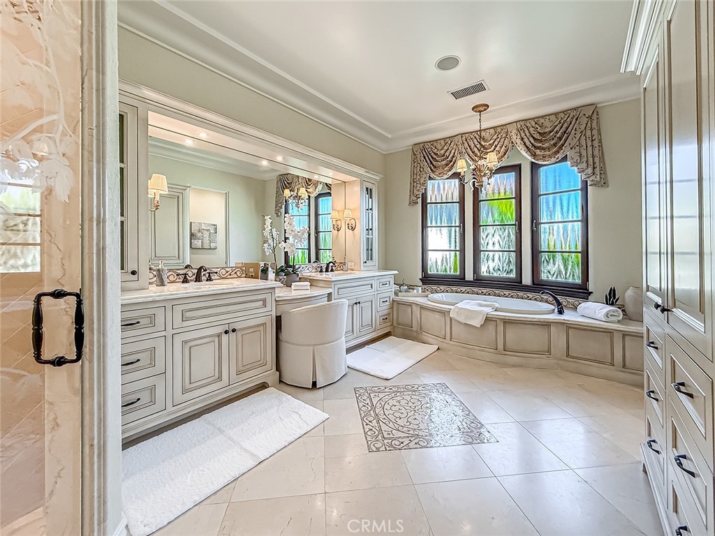 3826 Bowsprit Circle Westlake Village, CA 91361 - Photo 44 of 72 a large spacious bathroom with a double vanity sink a mirror and a bathtub