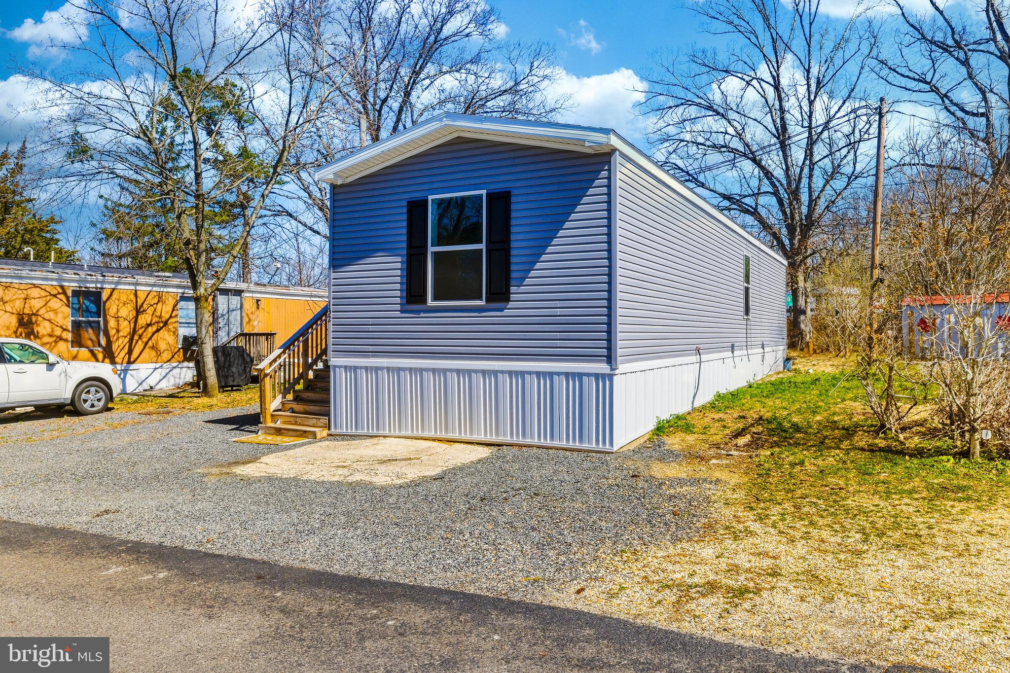 260 Marshall Mill Road, Unit 132 Malaga, NJ 08328 - Photo 7 of 11 a view of a house with backyard and sitting area