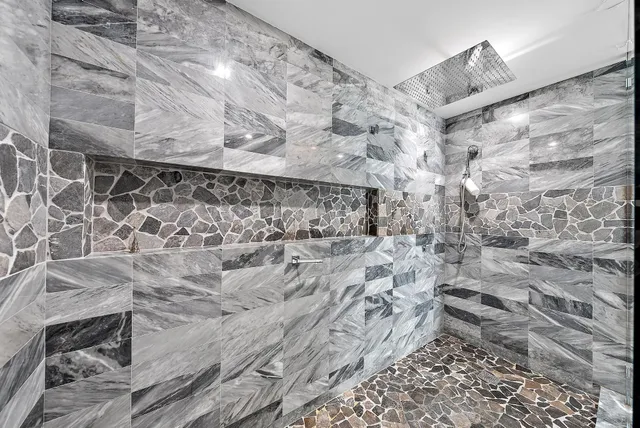 a bedroom with a bed and a view of kitchen