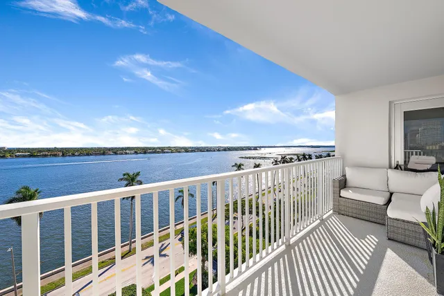 a view of a balcony with wooden floor