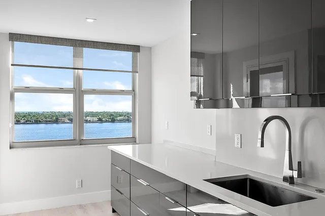 a kitchen with a sink and a window