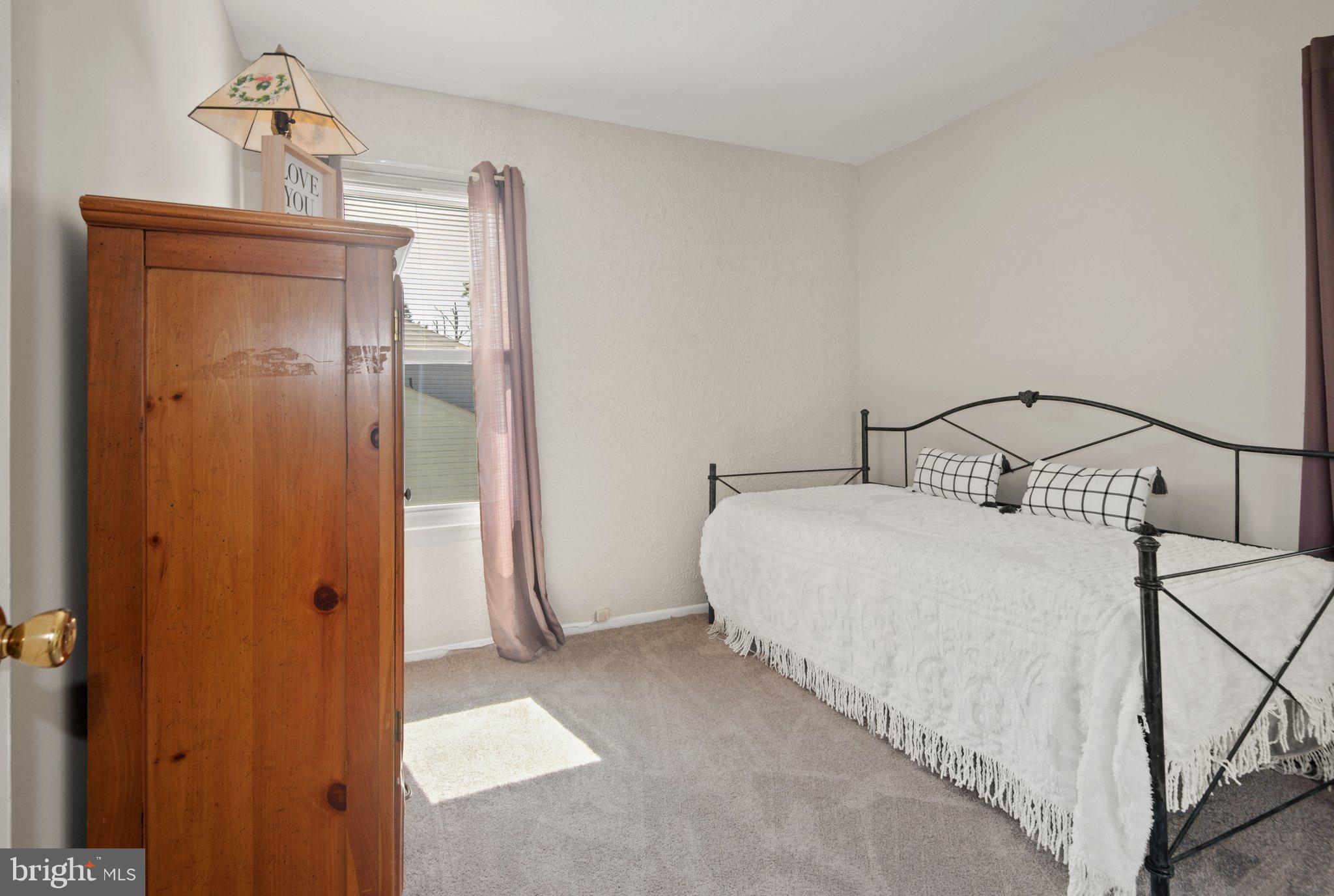 356 Laburnum Road Edgewood, MD 21040 - Photo 20 of 37 a bedroom with a bed and a mirror