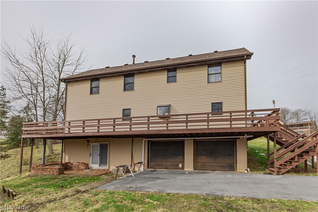 140 Iris Lane Colliers, WV 26035 - Photo 6 of 47 Rear view of property with a garage and a deck