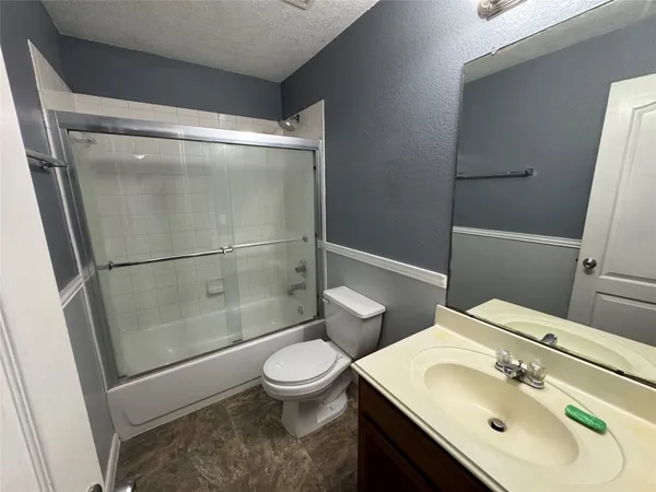 an empty room with a empty space and windows