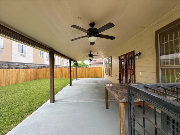 a view of a house with backyard porch and garden