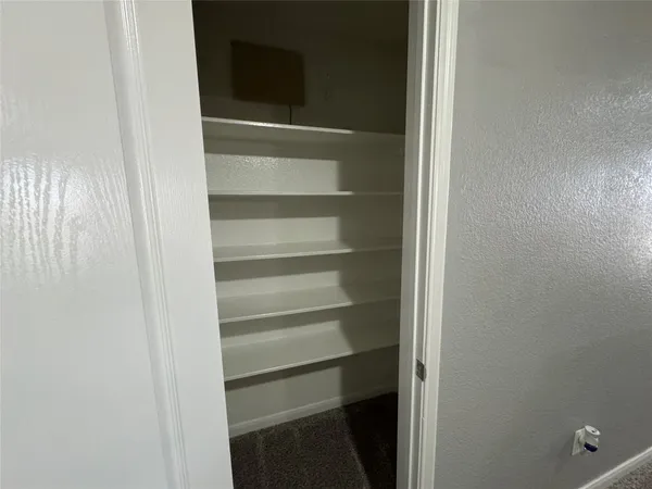 a bathroom with a bathtub and a window