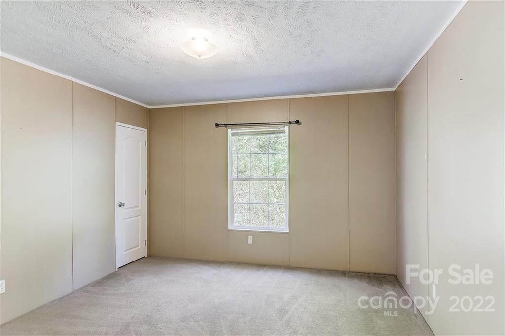 78 Alexander Road Alexander, NC 28701 - Photo 14 of 21 an empty room with windows