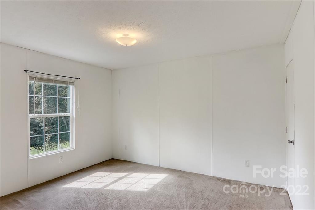 78 Alexander Road Alexander, NC 28701 - Photo 15 of 21 an empty room with windows