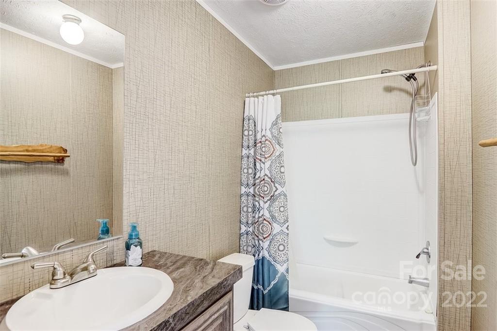 78 Alexander Road Alexander, NC 28701 - Photo 16 of 21 a bathroom with a sink toilet and shower