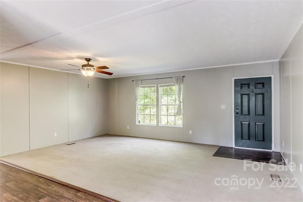 78 Alexander Road Alexander, NC 28701 - Photo 5 of 21 a view of an empty room with a window