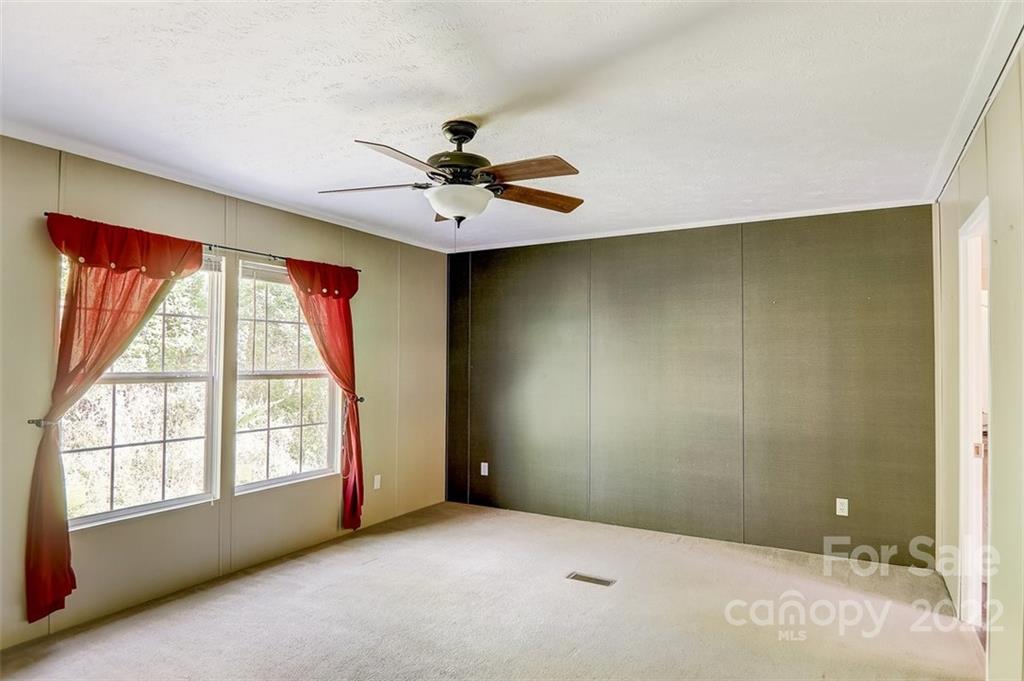 78 Alexander Road Alexander, NC 28701 - Photo 10 of 21 a view of an empty room with a window