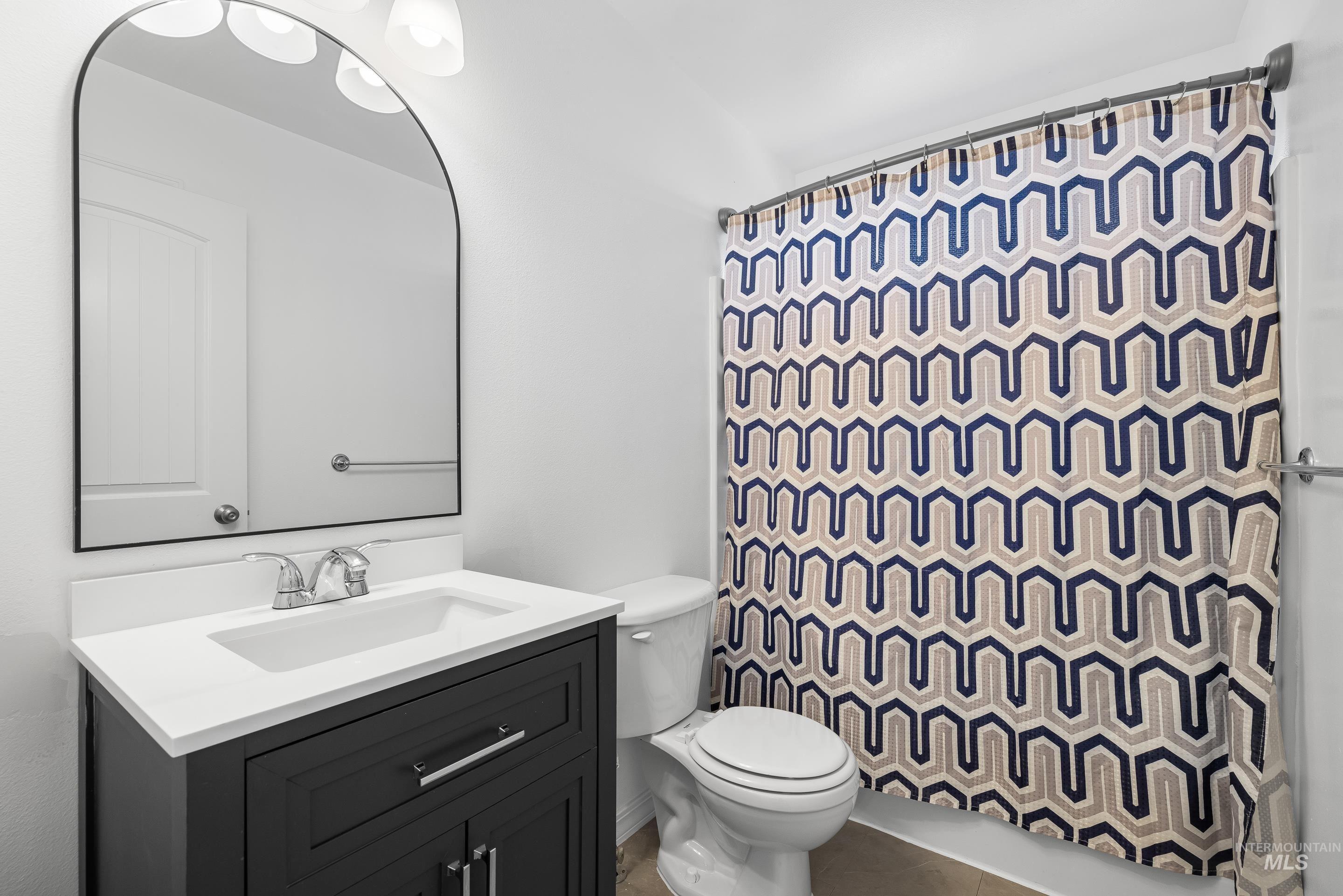 215 Northeast Rosa Court Mountain Home, ID 83647 - Photo 30 of 39 Bathroom featuring vanity and toilet