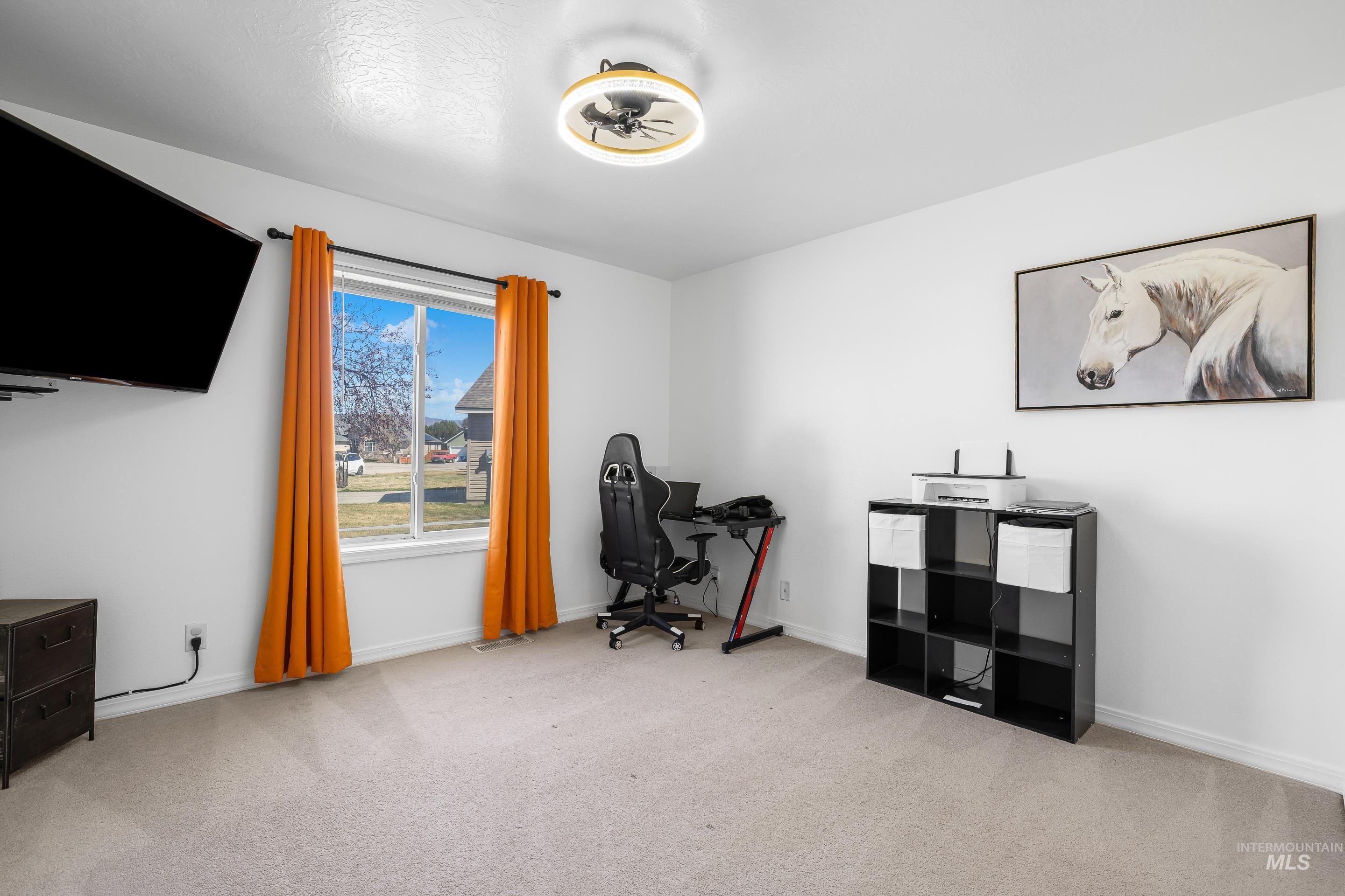 215 Northeast Rosa Court Mountain Home, ID 83647 - Photo 31 of 39 Office space with light carpet and baseboards