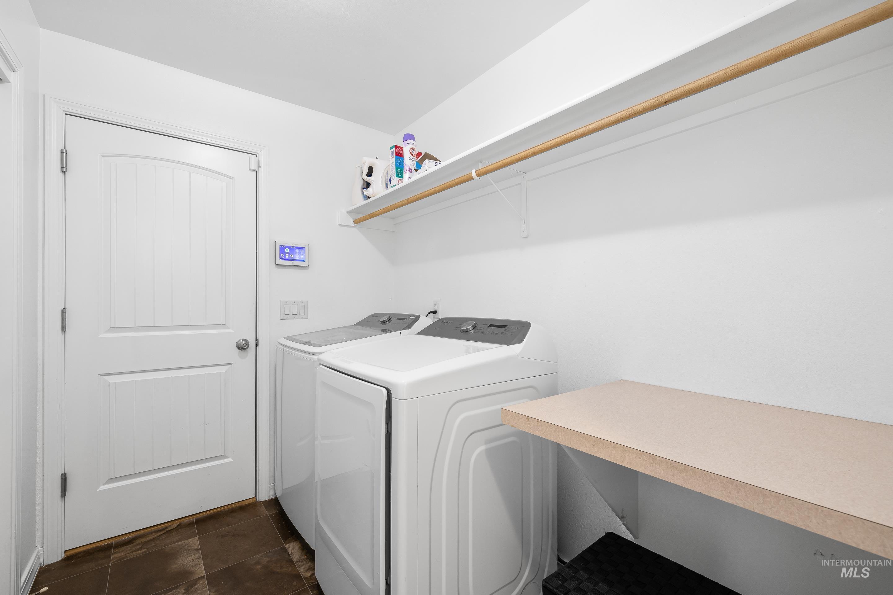 215 Northeast Rosa Court Mountain Home, ID 83647 - Photo 32 of 39 Laundry room featuring independent washer and dryer