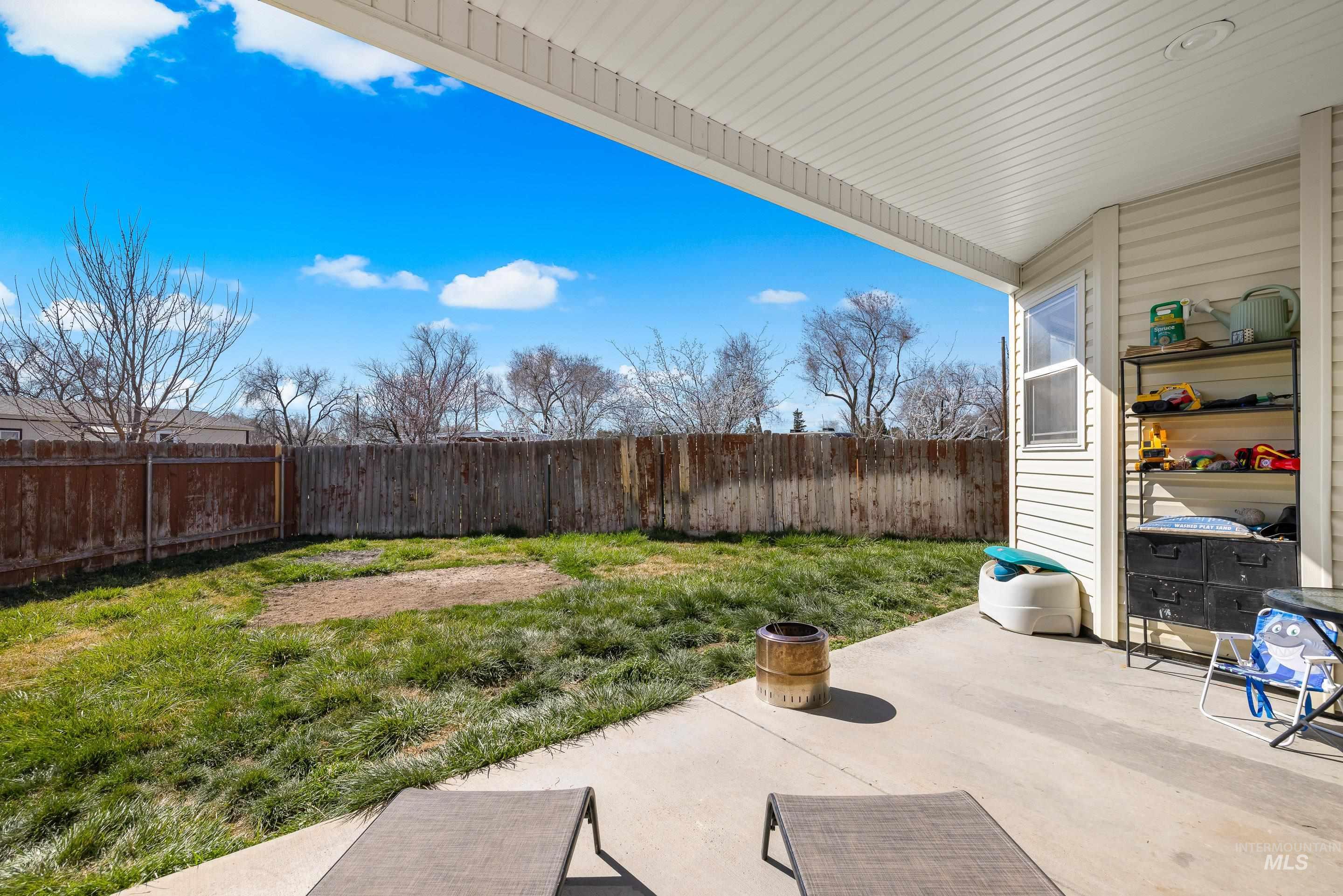215 Northeast Rosa Court Mountain Home, ID 83647 - Photo 35 of 39 Fenced backyard with a patio