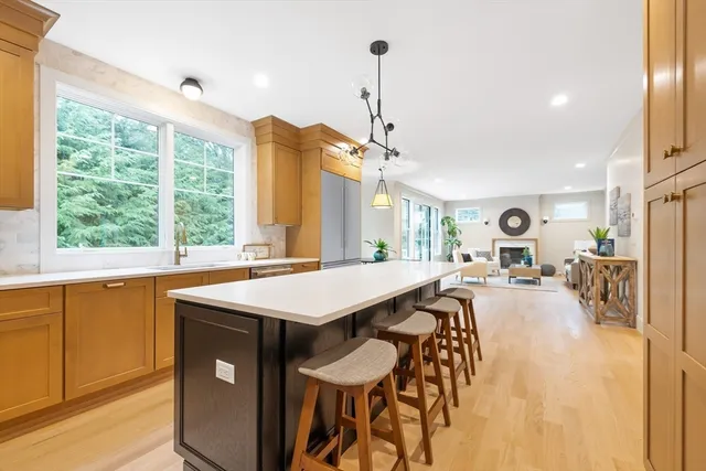 a very nice looking room with a large window and furniture