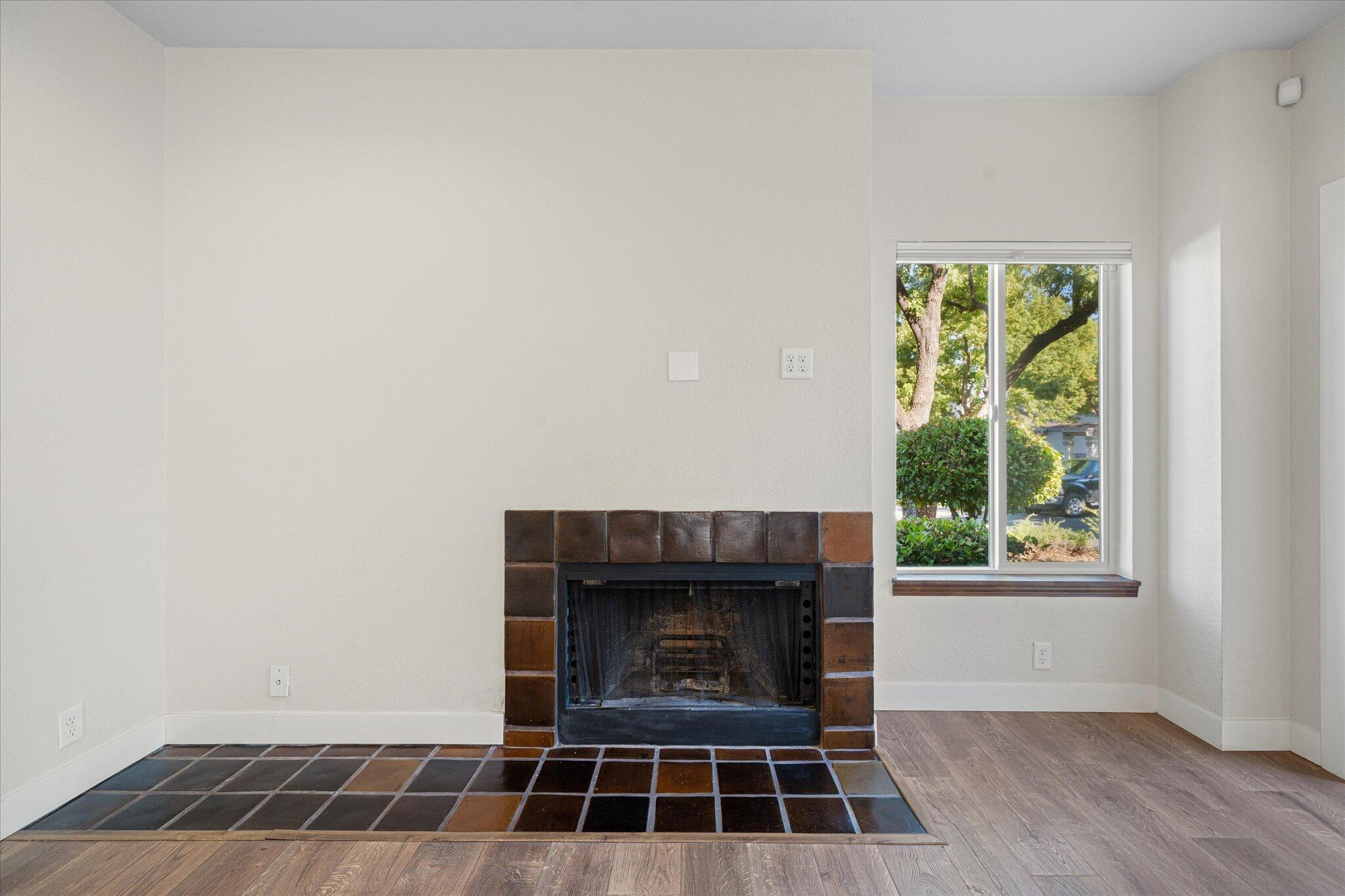 488 Ridgecrest Trail, Unit 132 Redding, CA 96003 - Photo 11 of 51 a living room with a fireplace and a window