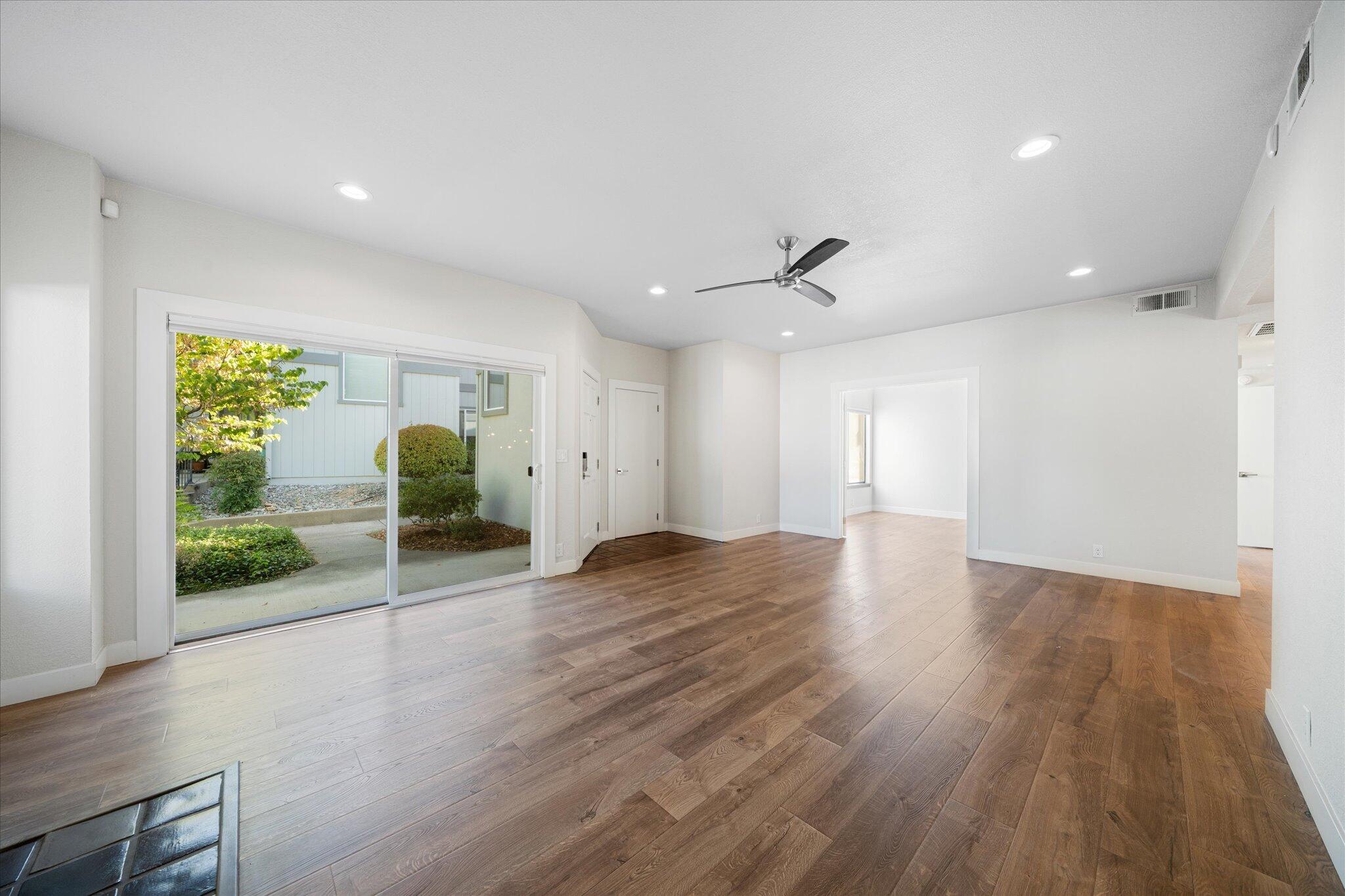 488 Ridgecrest Trail, Unit 132 Redding, CA 96003 - Photo 12 of 51 a view of a livingroom with wooden floor and a ceiling fan