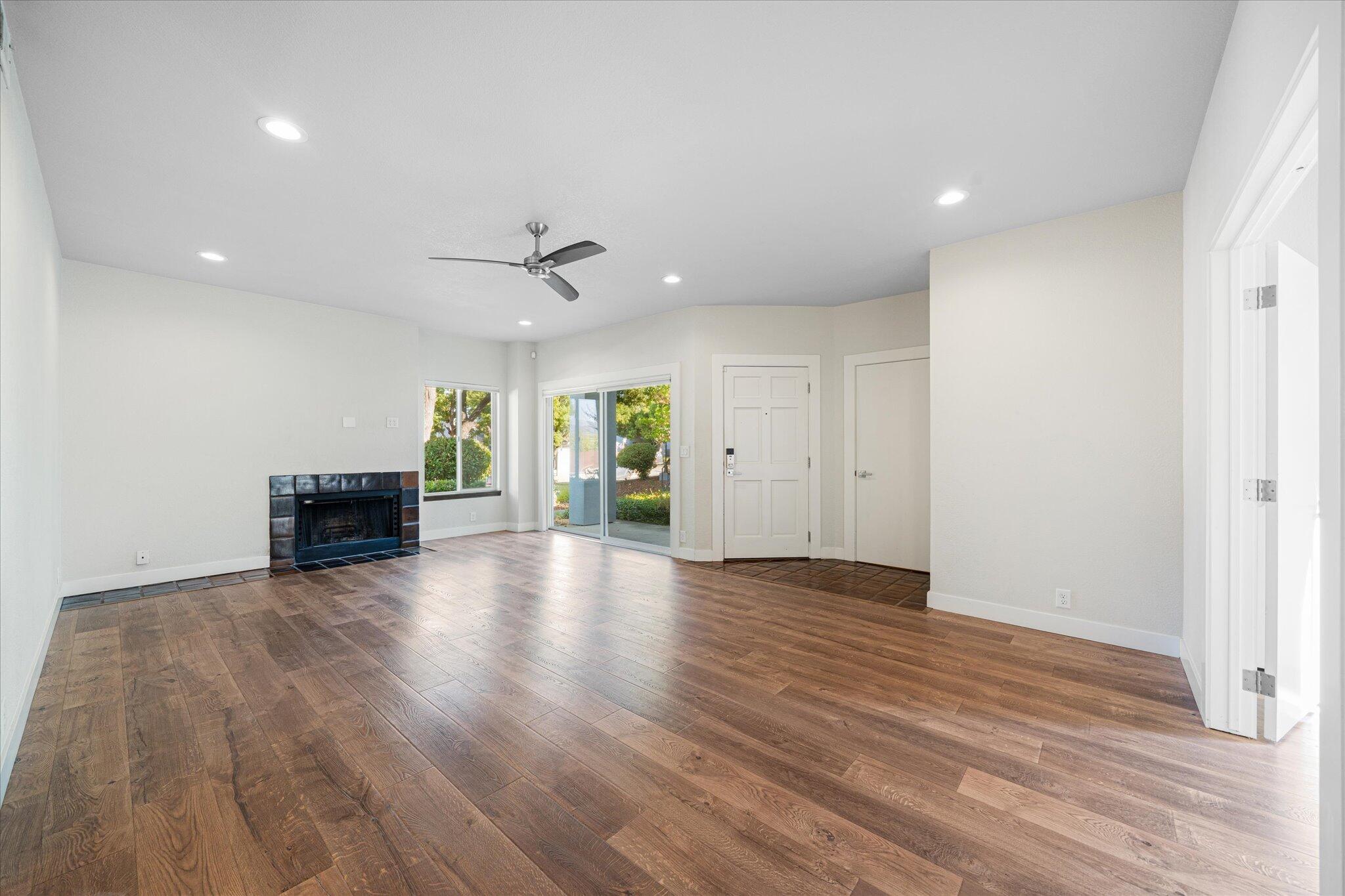 488 Ridgecrest Trail, Unit 132 Redding, CA 96003 - Photo 13 of 51 a view of a livingroom with wooden floor and a ceiling fan