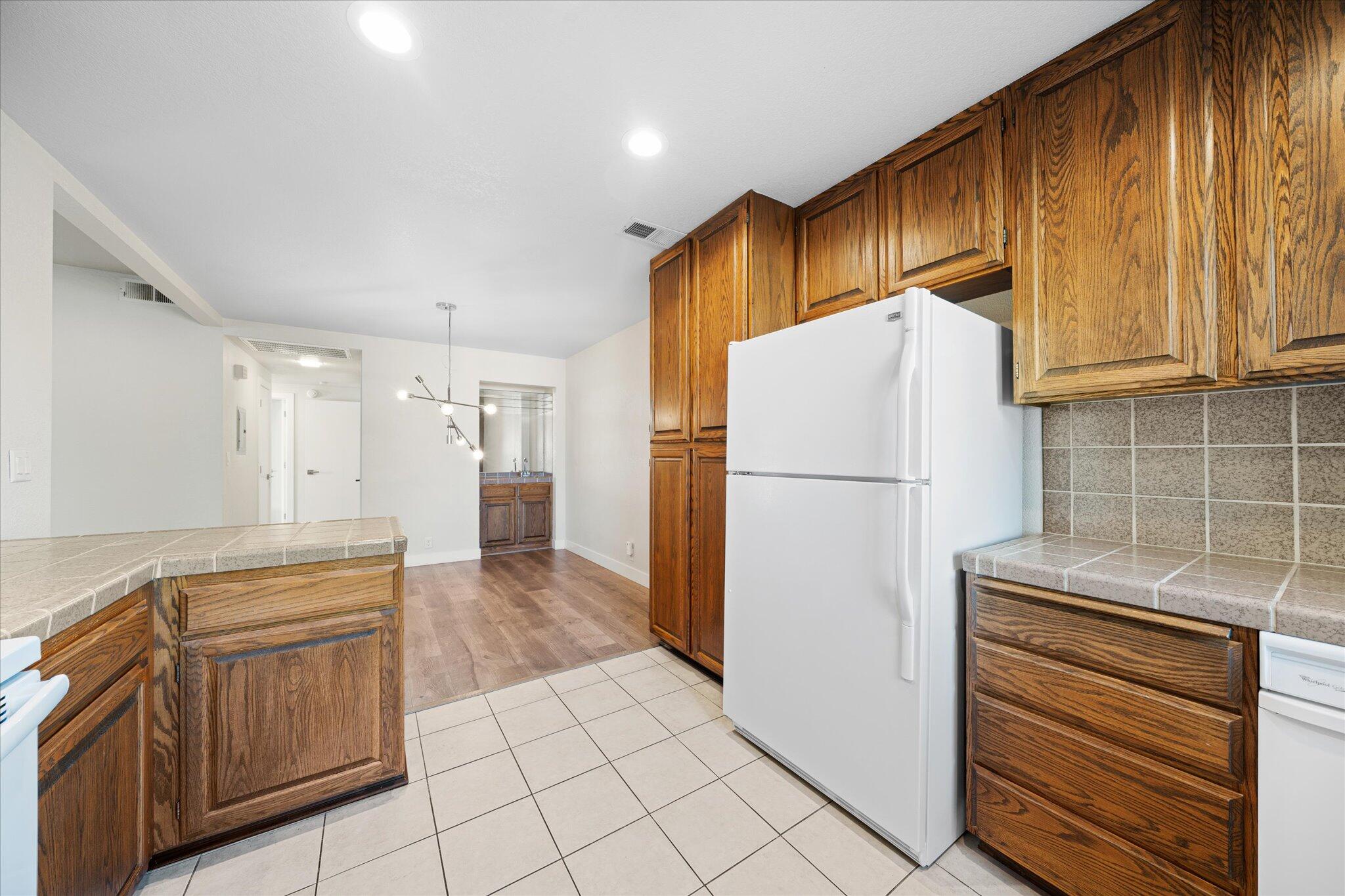 488 Ridgecrest Trail, Unit 132 Redding, CA 96003 - Photo 20 of 51 a kitchen with a refrigerator and a sink