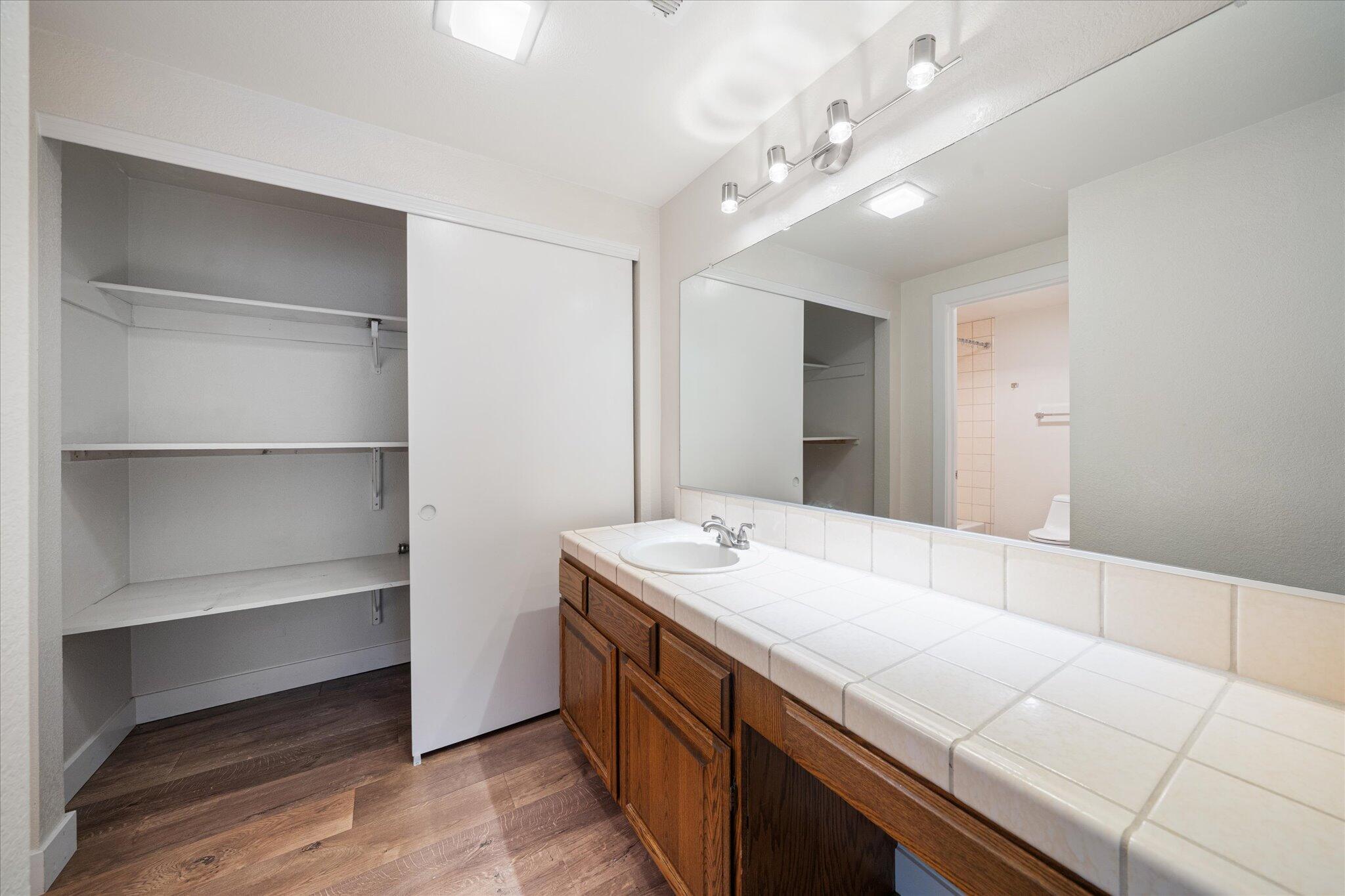 488 Ridgecrest Trail, Unit 132 Redding, CA 96003 - Photo 24 of 51 a bathroom with a sink a vanity and a mirror