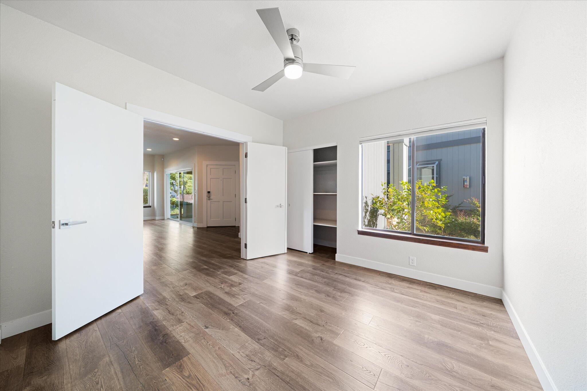 488 Ridgecrest Trail, Unit 132 Redding, CA 96003 - Photo 26 of 51 an empty room with wooden floor and windows