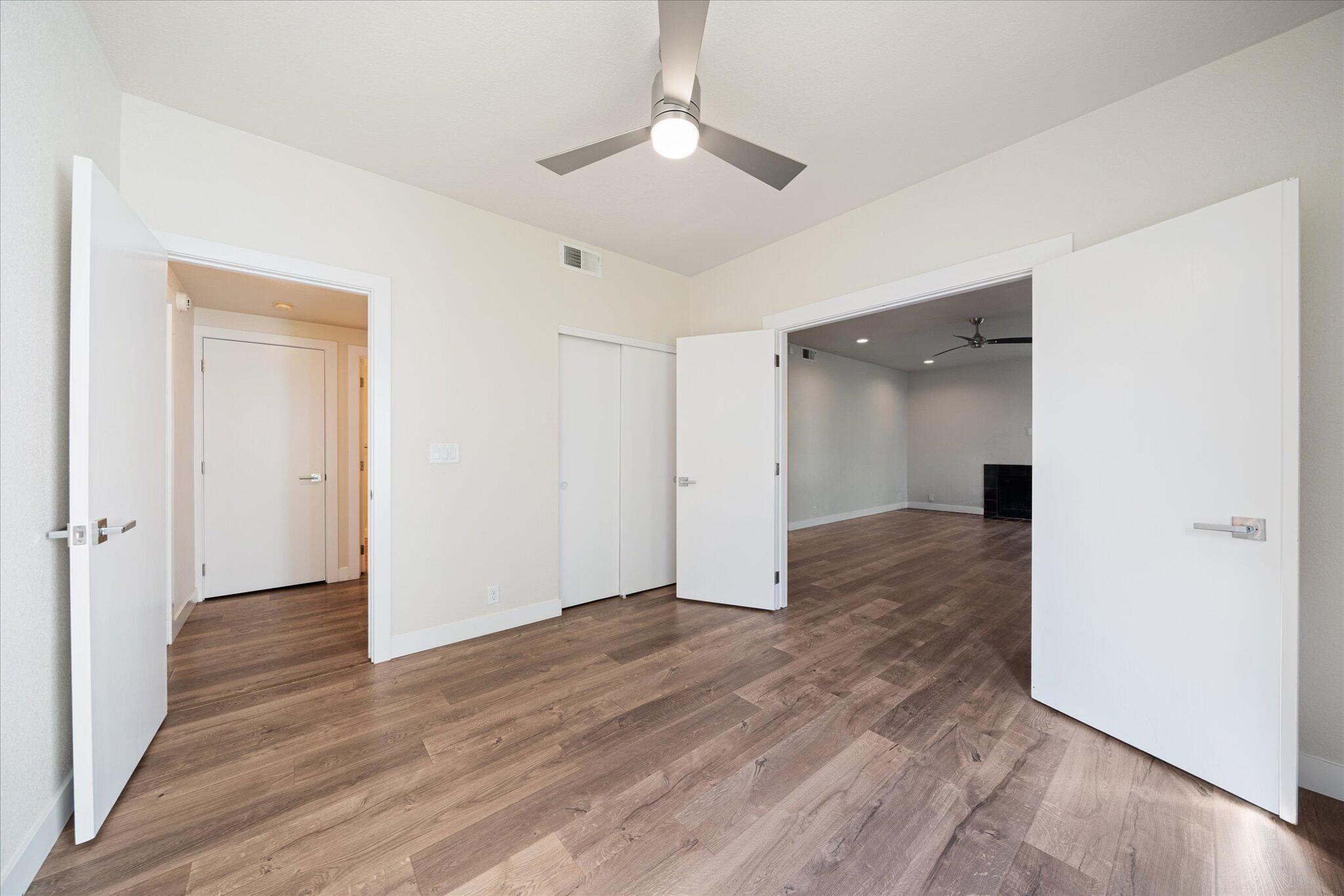 488 Ridgecrest Trail, Unit 132 Redding, CA 96003 - Photo 27 of 51 an empty room with wooden floor and a ceiling fan