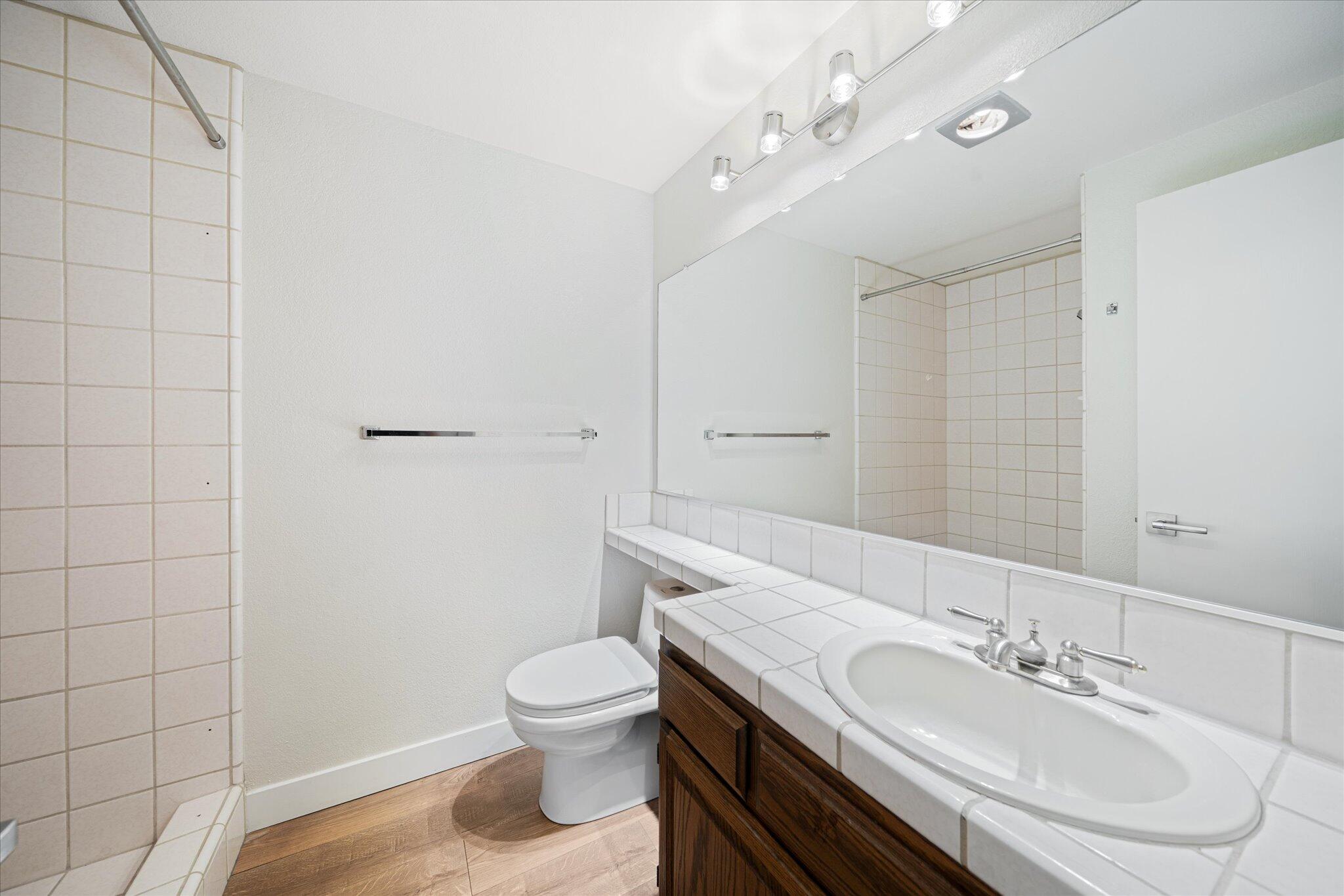 488 Ridgecrest Trail, Unit 132 Redding, CA 96003 - Photo 28 of 51 a bathroom with a sink a toilet and shower