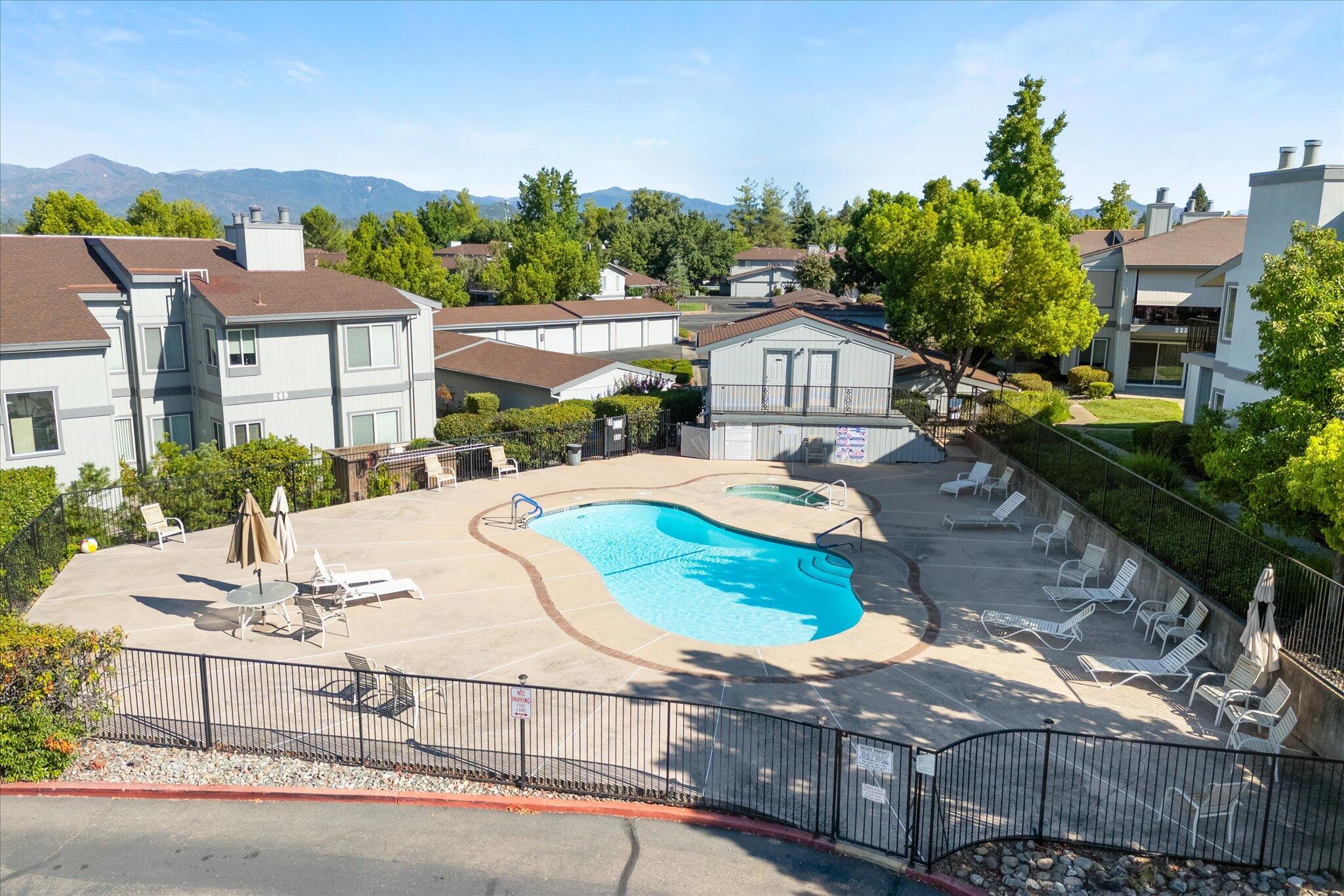 488 Ridgecrest Trail, Unit 132 Redding, CA 96003 - Photo 31 of 51 a view of multiple houses with a yard