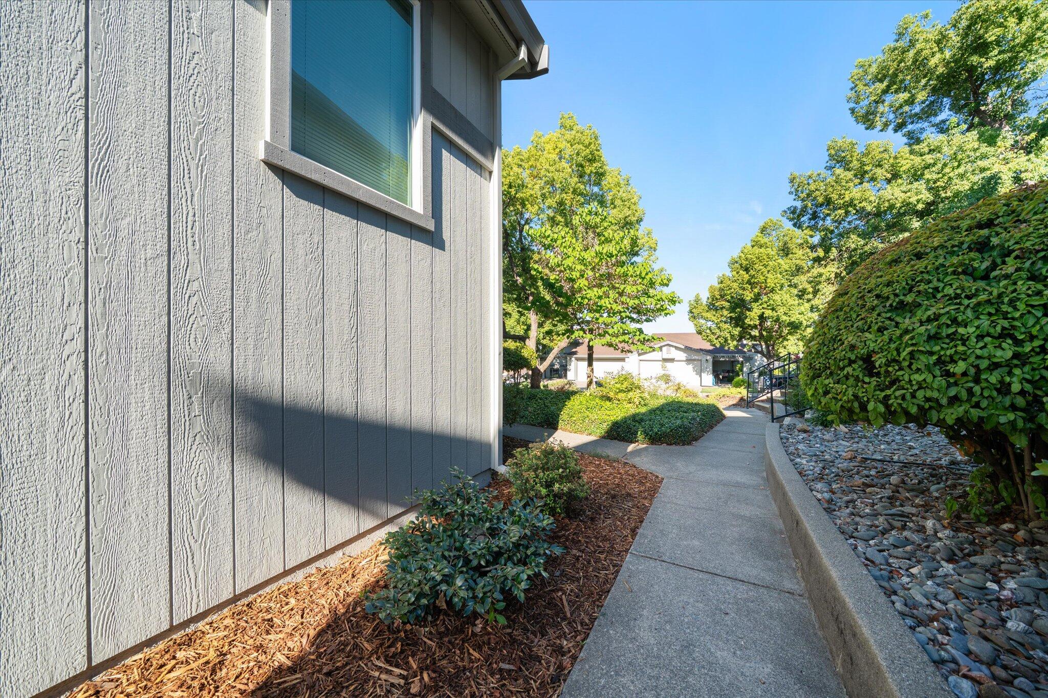 488 Ridgecrest Trail, Unit 132 Redding, CA 96003 - Photo 33 of 51 a view of a pathway of a house with a yard