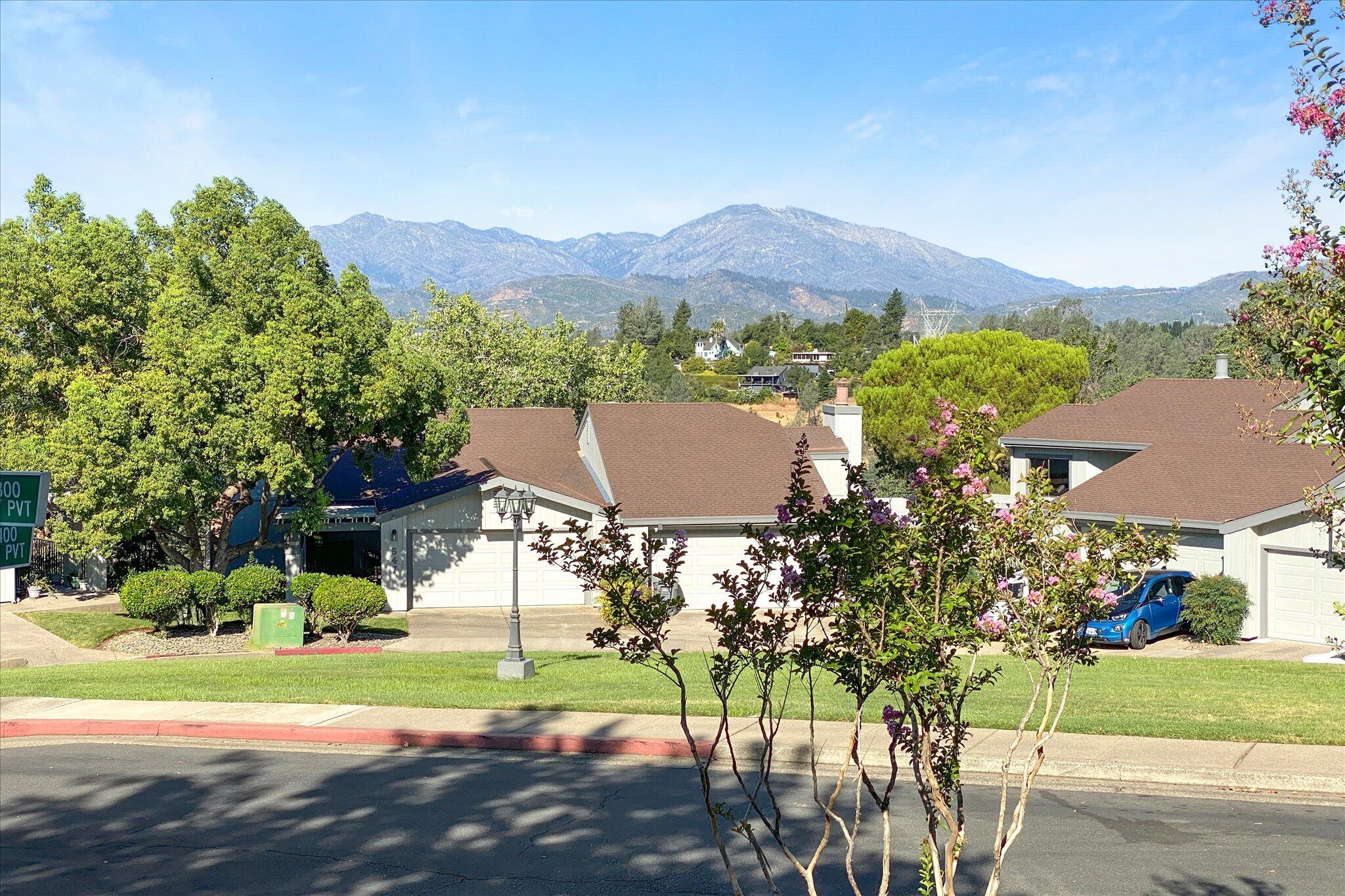 488 Ridgecrest Trail, Unit 132 Redding, CA 96003 - Photo 35 of 51 a view of a house with a yard and a garden