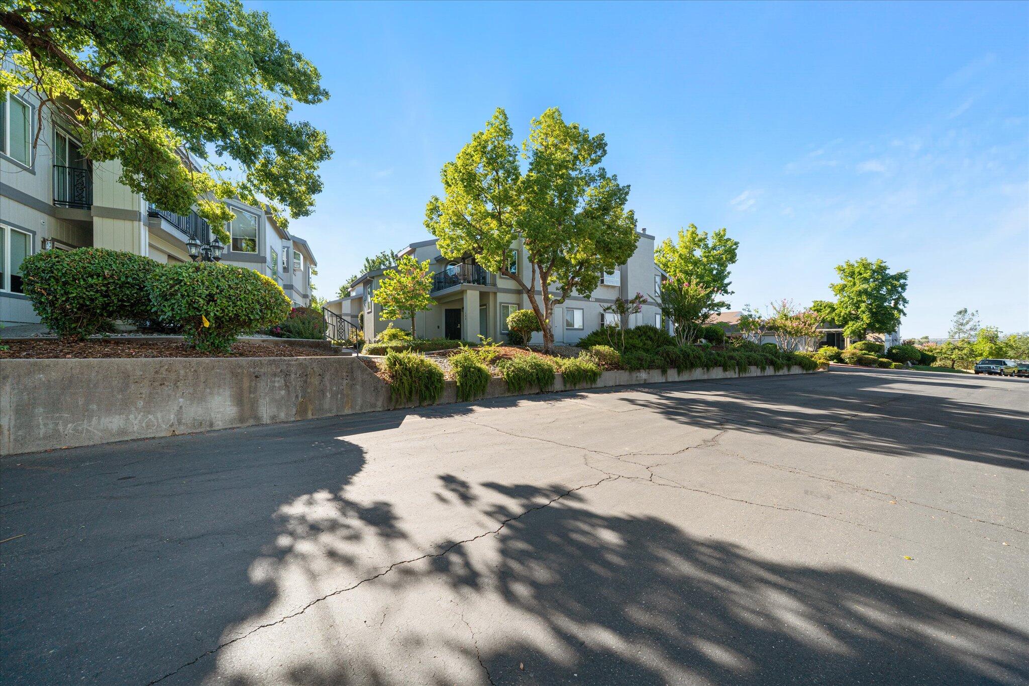488 Ridgecrest Trail, Unit 132 Redding, CA 96003 - Photo 39 of 51 a view of a street with a yard