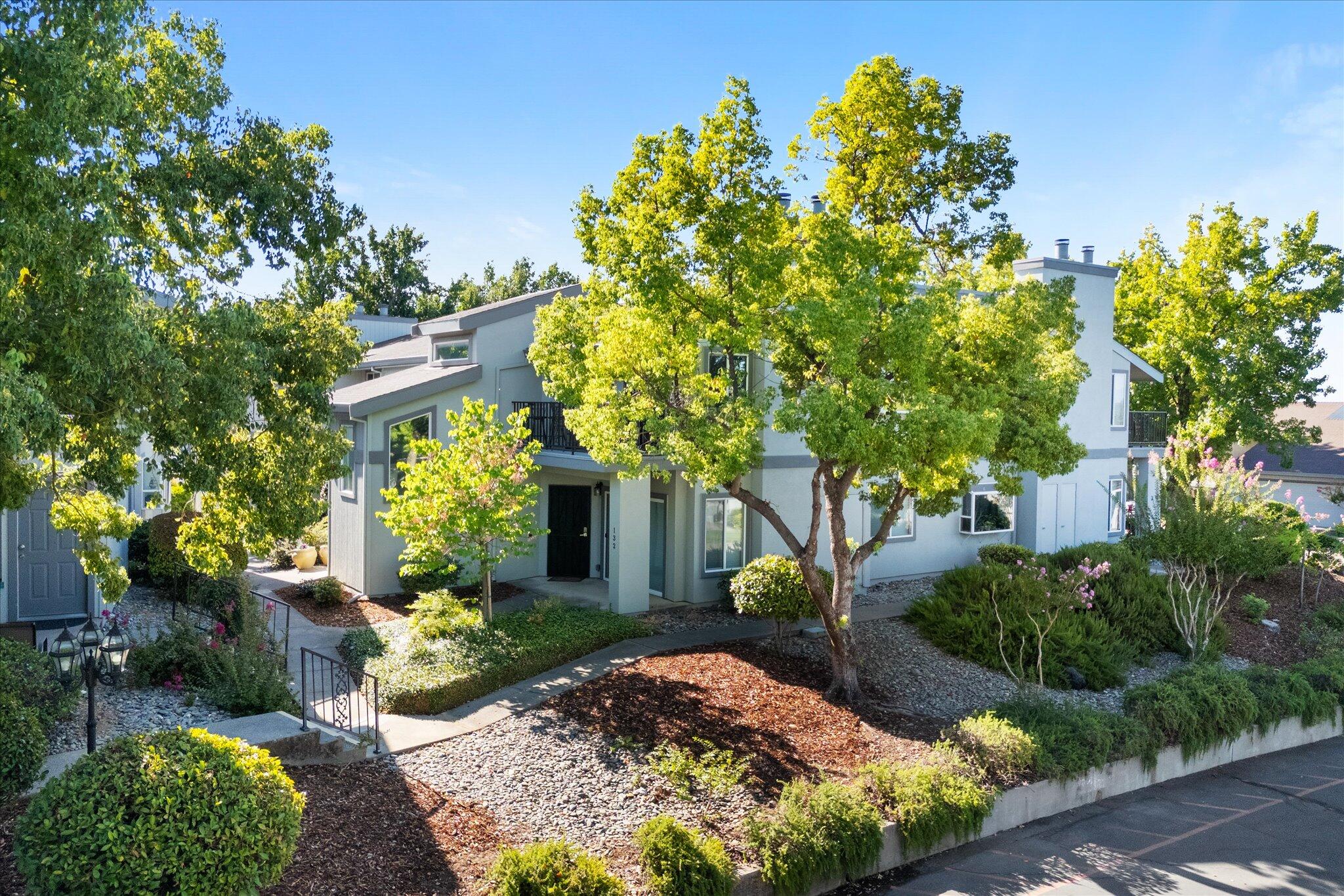488 Ridgecrest Trail, Unit 132 Redding, CA 96003 - Photo 42 of 51 a front view of a house with garden