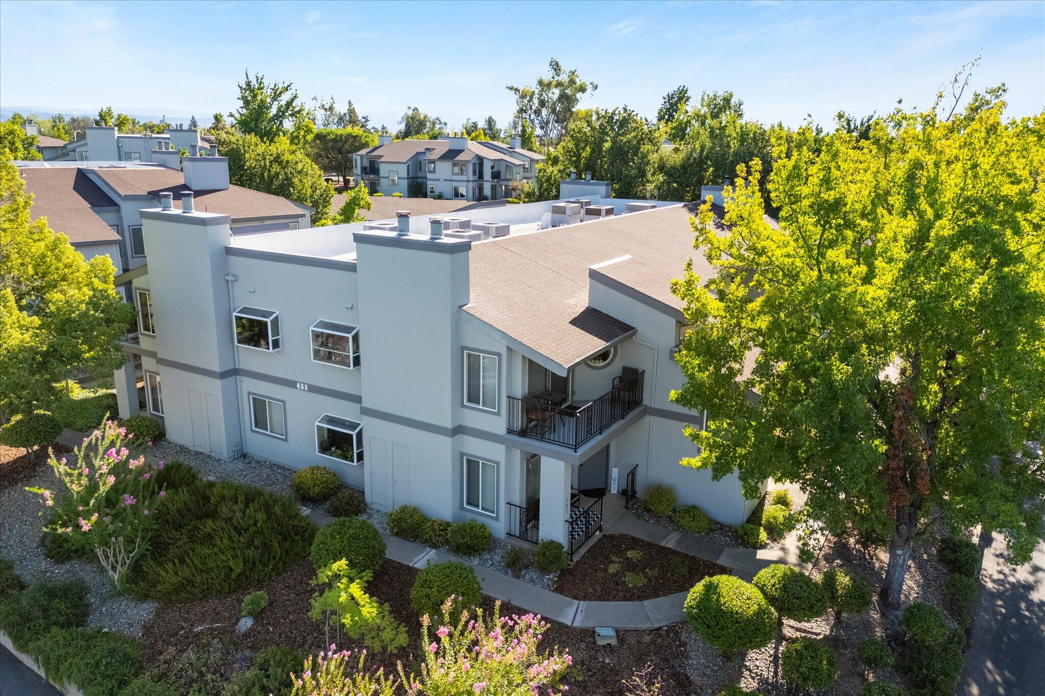 488 Ridgecrest Trail, Unit 132 Redding, CA 96003 - Photo 43 of 51 a view of a house with a yard and garden