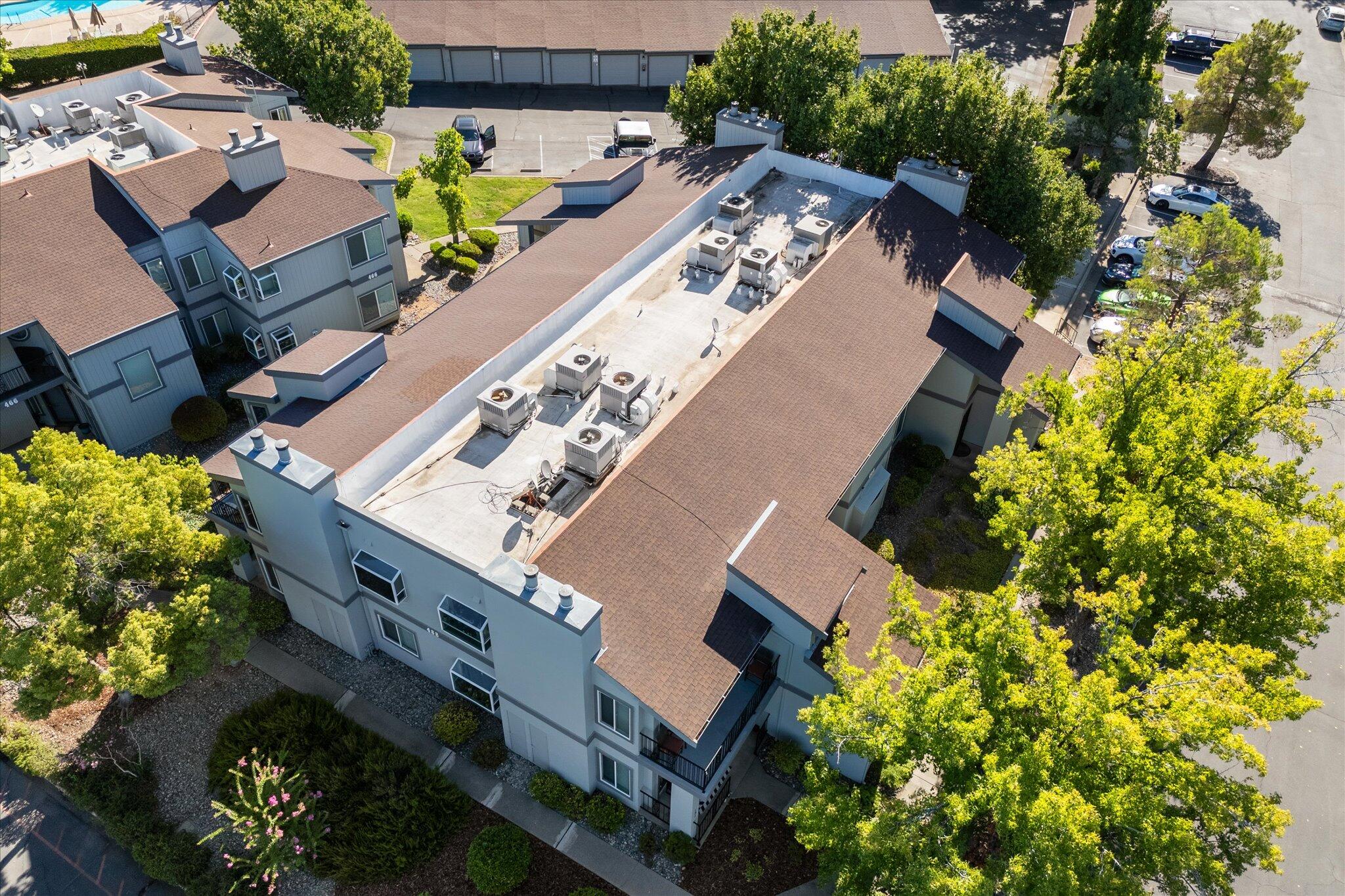 488 Ridgecrest Trail, Unit 132 Redding, CA 96003 - Photo 44 of 51 an aerial view of a house with a yard and garden