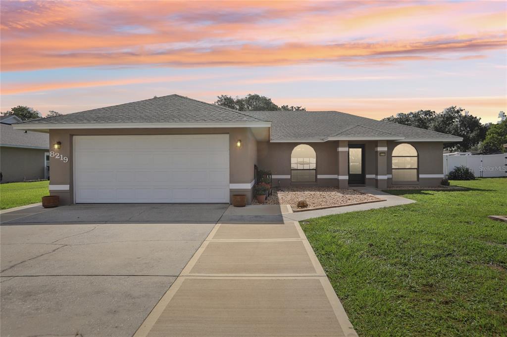 8219 Rangers Path Lakeland, FL 33809 - Photo 1 of 1 a front view of a house with yard