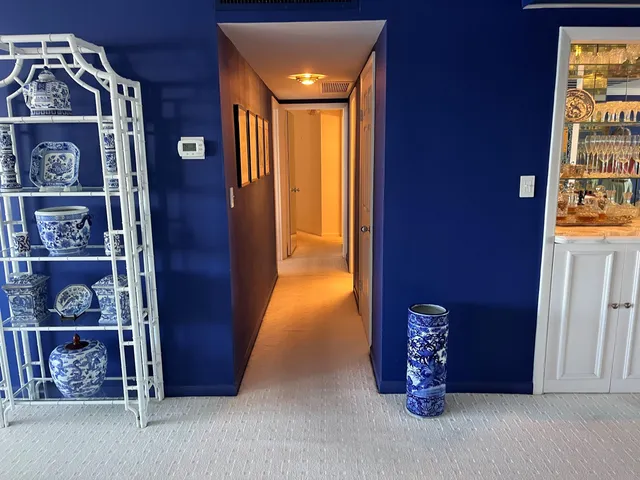 a living room with furniture and a mirror