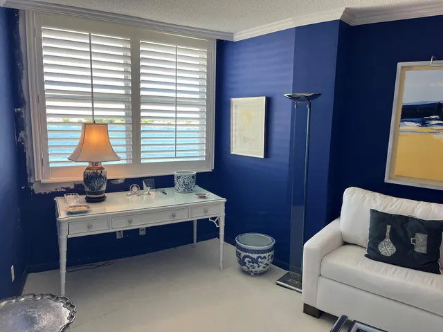 a living room with fireplace furniture and a book shelf