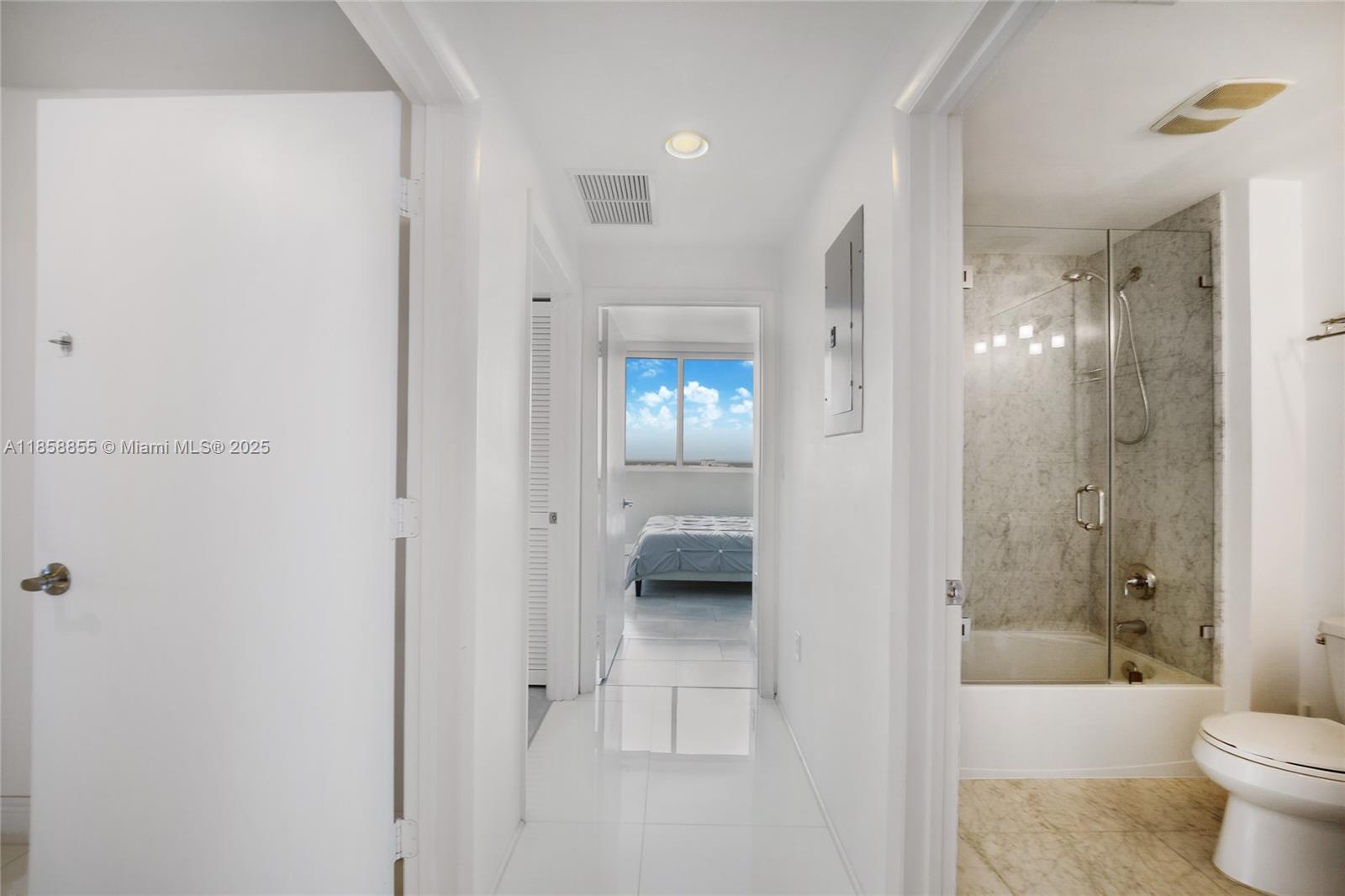 253 Northeast 2nd Street, Unit 3302 Miami, FL 33132 - Photo 12 of 27 a bathroom with a shower and a bathtub