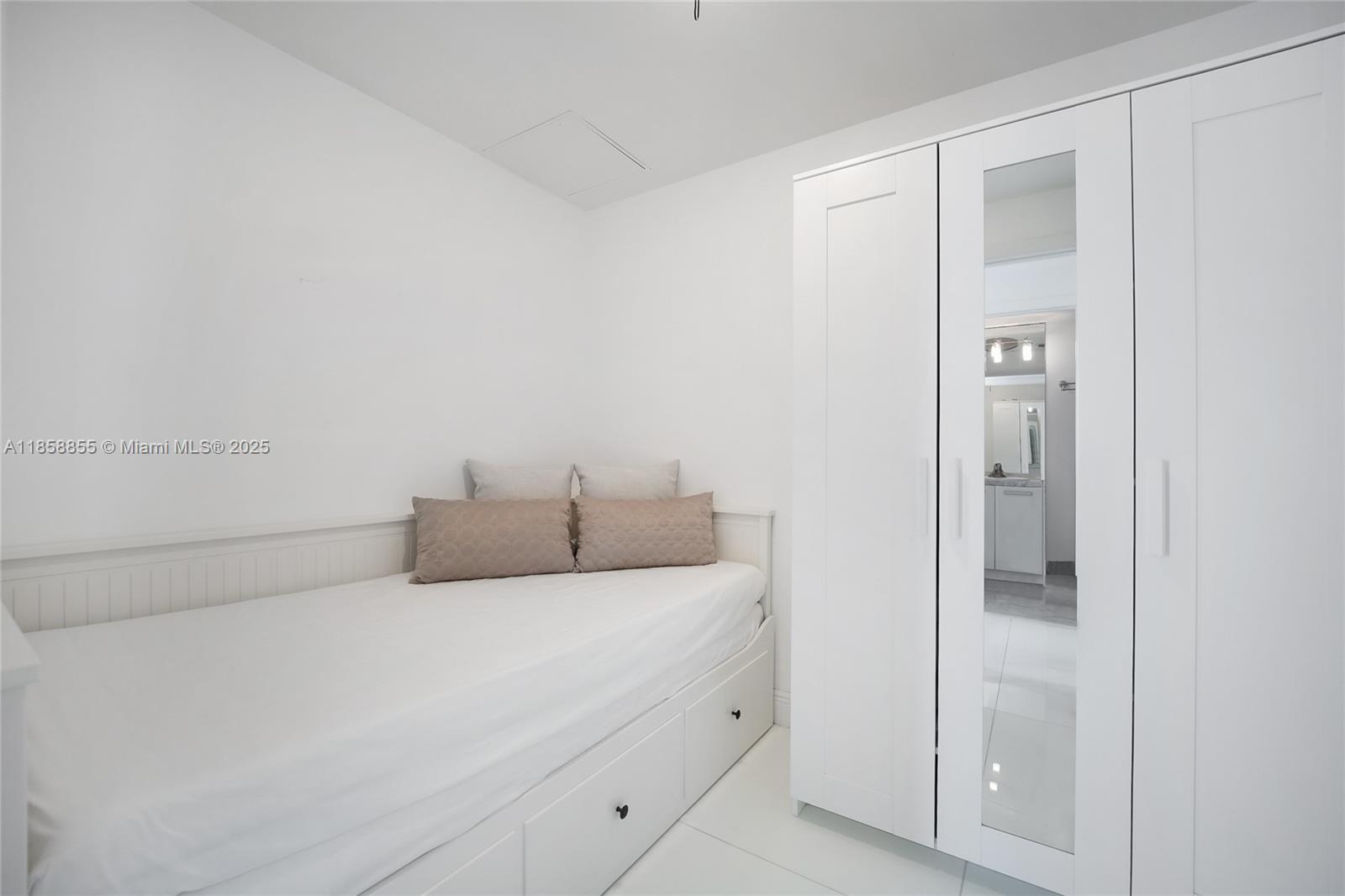 253 Northeast 2nd Street, Unit 3302 Miami, FL 33132 - Photo 13 of 27 a bedroom with a bed and closet