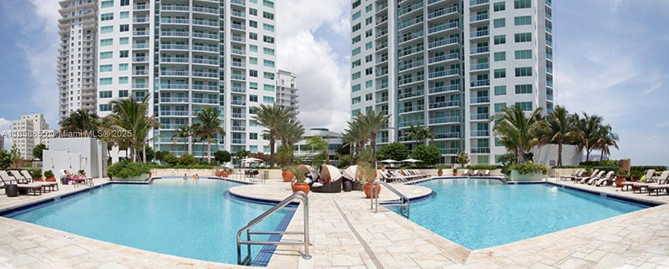 253 Northeast 2nd Street, Unit 3302 Miami, FL 33132 - Photo 19 of 27 a view of swimming pool with outdoor seating