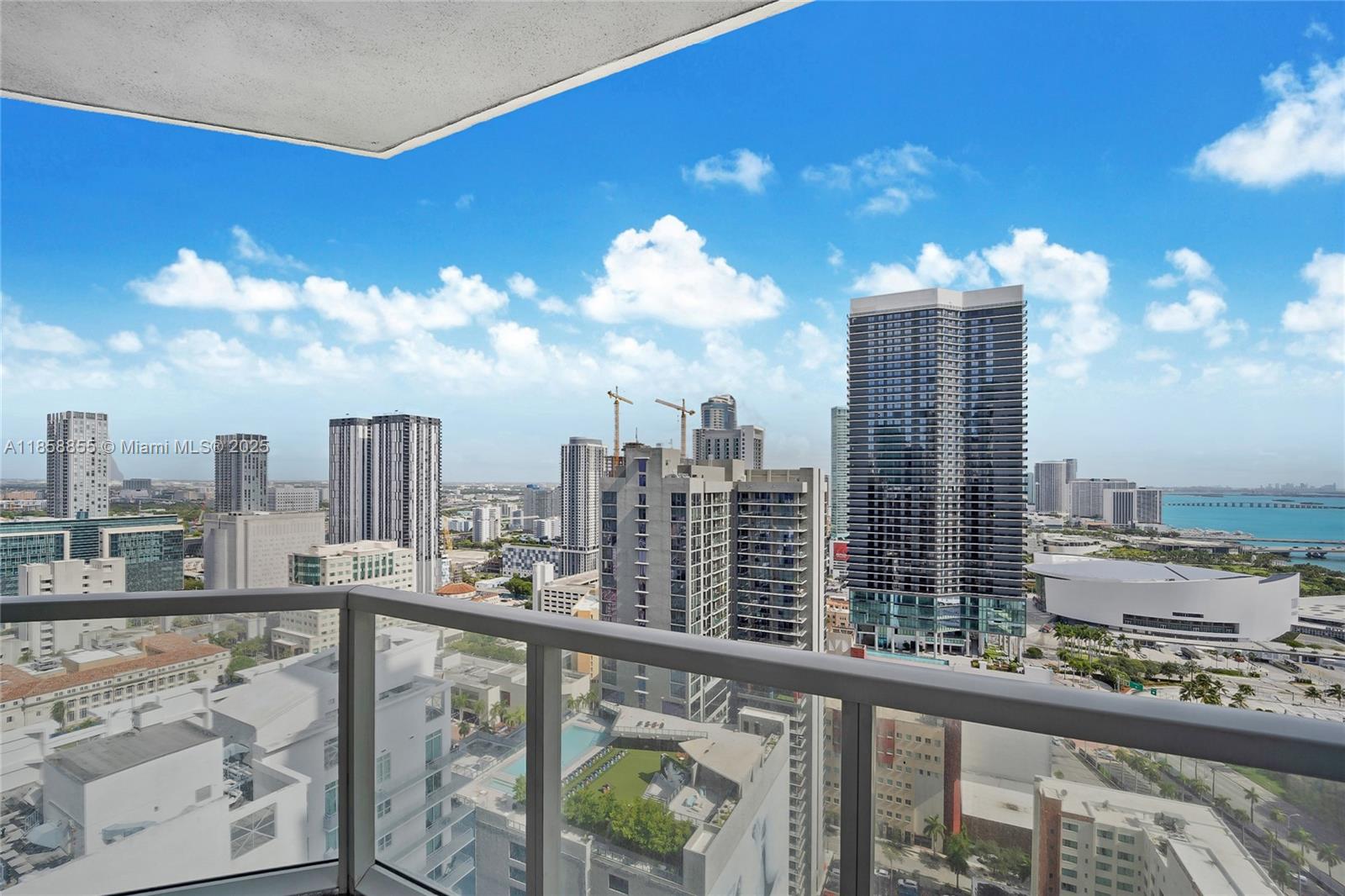 253 Northeast 2nd Street, Unit 3302 Miami, FL 33132 - Photo 6 of 27 a view of a city from a balcony