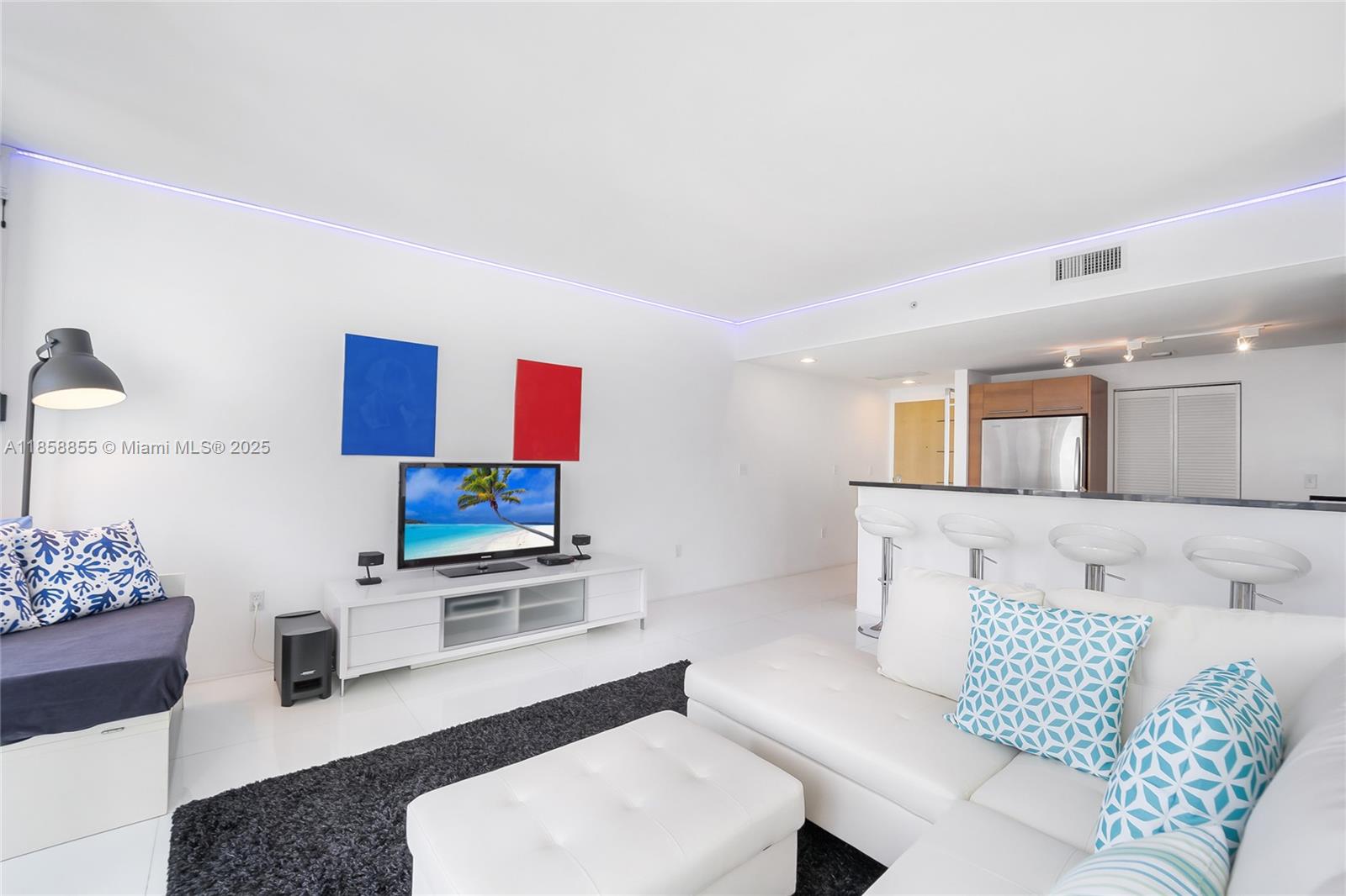 253 Northeast 2nd Street, Unit 3302 Miami, FL 33132 - Photo 8 of 27 a living room with furniture and a couch