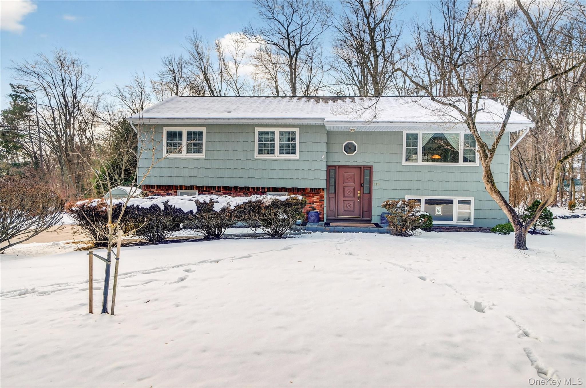 115 Old Pascack Road Pearl River, NY 10965 - Photo 1 of 1 a front view of a house with a yard covered in snow