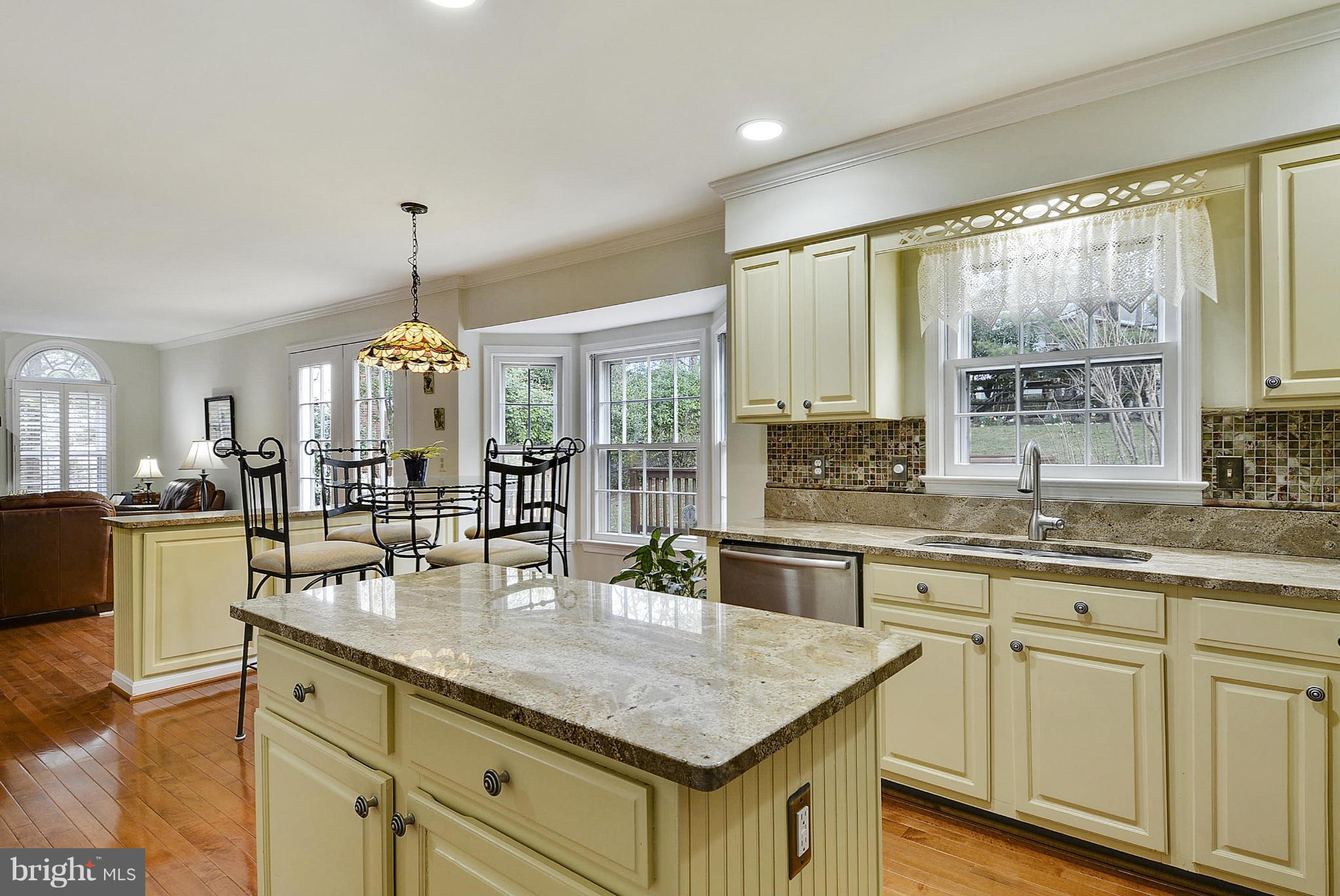 11952 Grey Squirrel Lane Reston, VA 20194 - Photo 3 of 30 a kitchen with center island and large windows