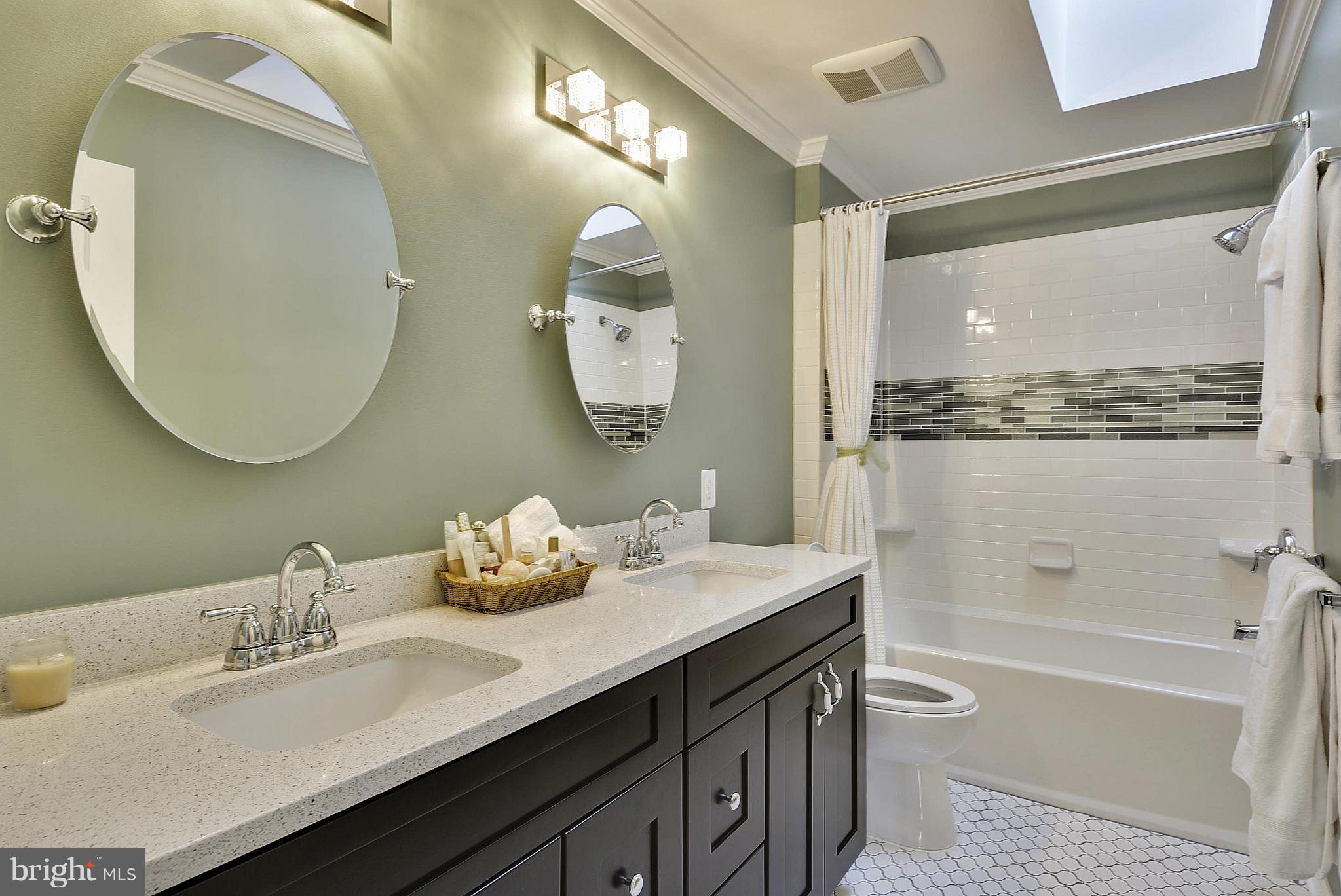 11952 Grey Squirrel Lane Reston, VA 20194 - Photo 22 of 30 a bathroom with a double vanity sink mirror and bathtub