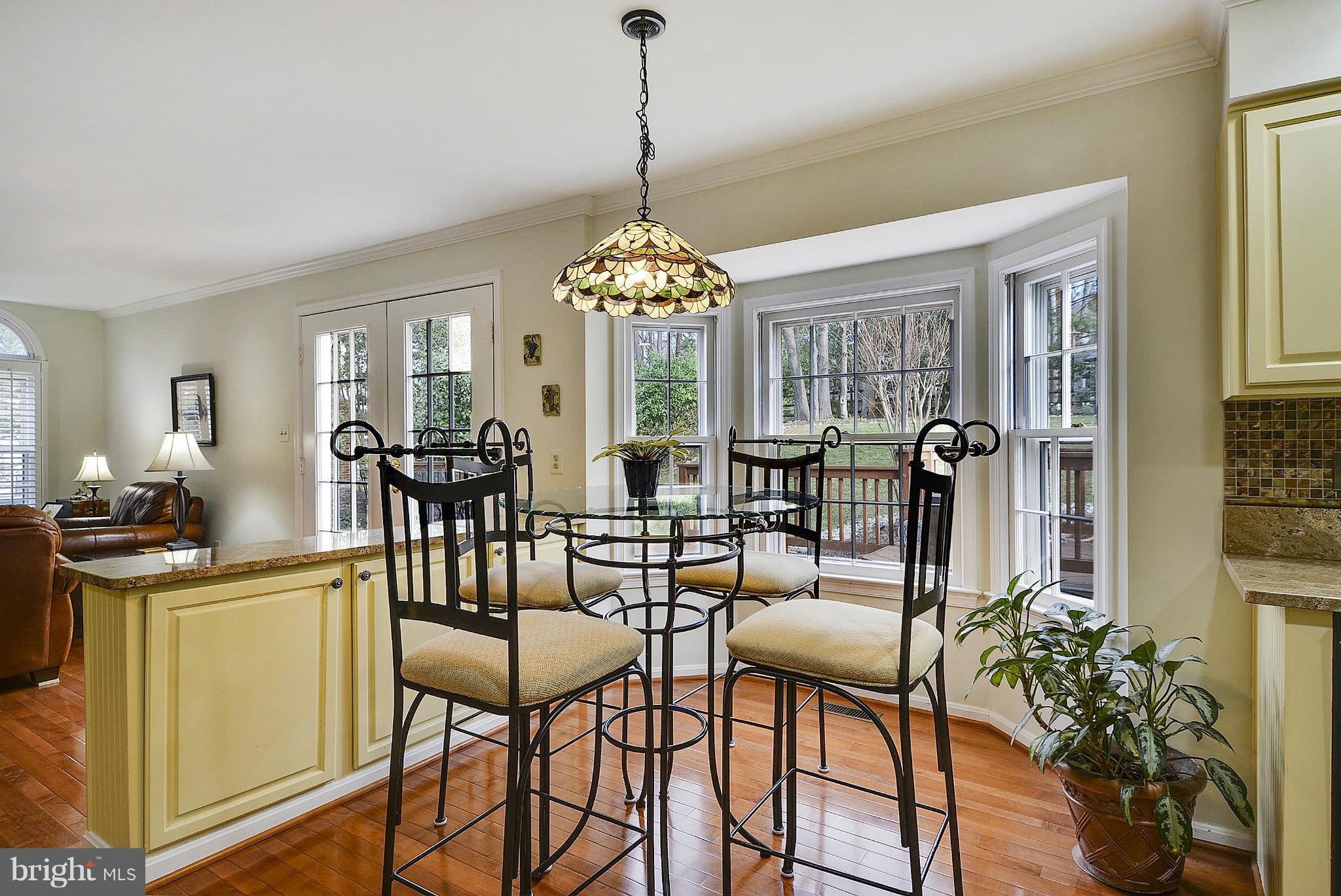 11952 Grey Squirrel Lane Reston, VA 20194 - Photo 4 of 30 a view of a dining room with furniture and chandelier