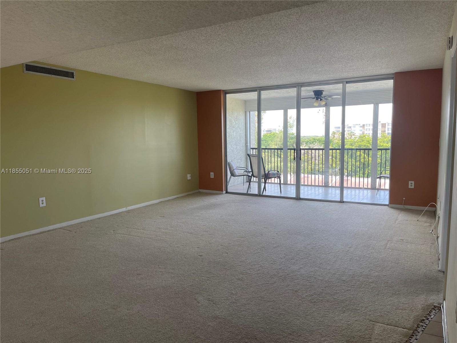 a view of an empty room with a sliding door