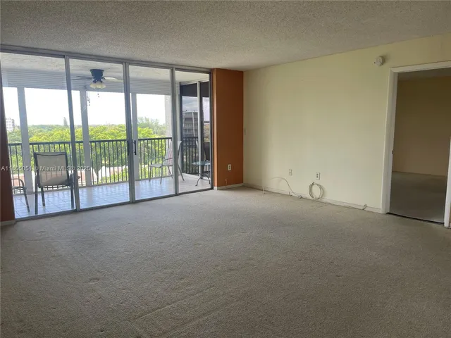 a view of an empty room with a sliding door