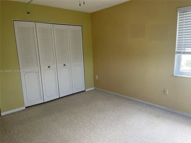 a view of a hallway with closet